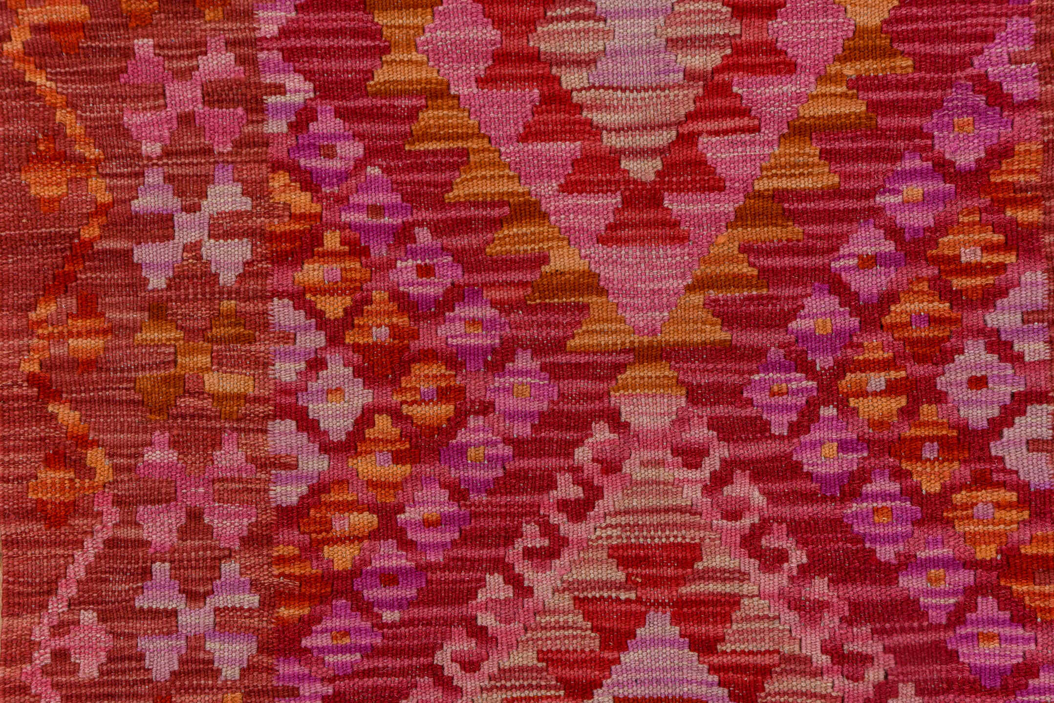 2' x 9' one-of-a-kind handmade vintage Kilim runner rug. Color palette: rose, pink, rust, magenta, terra cotta, ivory