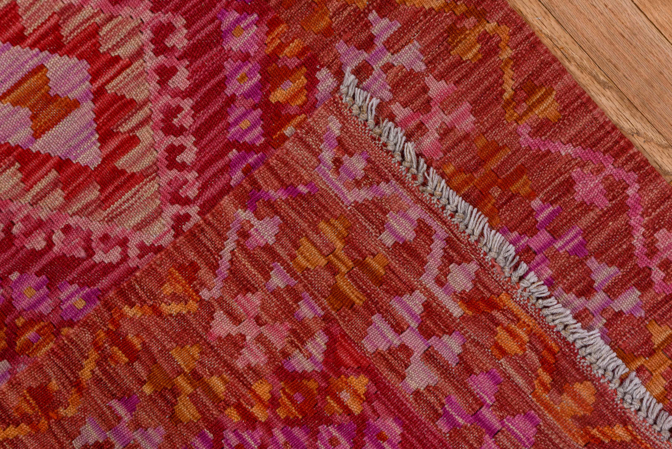 2' x 9' one-of-a-kind handmade vintage Kilim runner rug. Color palette: rose, pink, rust, magenta, terra cotta, ivory