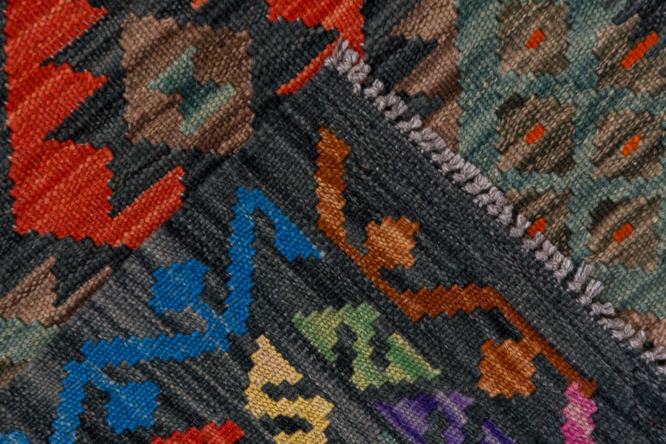 2' x 9' one-of-a-kind handmade vintage Kilim runner rug. Color palette: charcoal, crimson, turquoise, coral, ivory, lavender