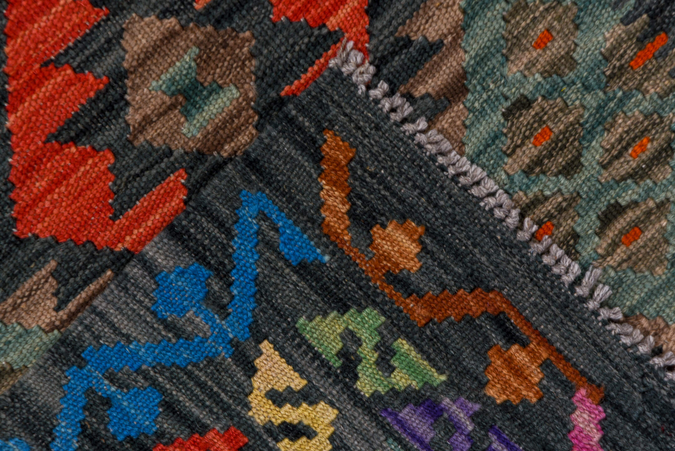 2' x 9' one-of-a-kind handmade vintage Kilim runner rug. Color palette: charcoal, crimson, turquoise, coral, ivory, lavender