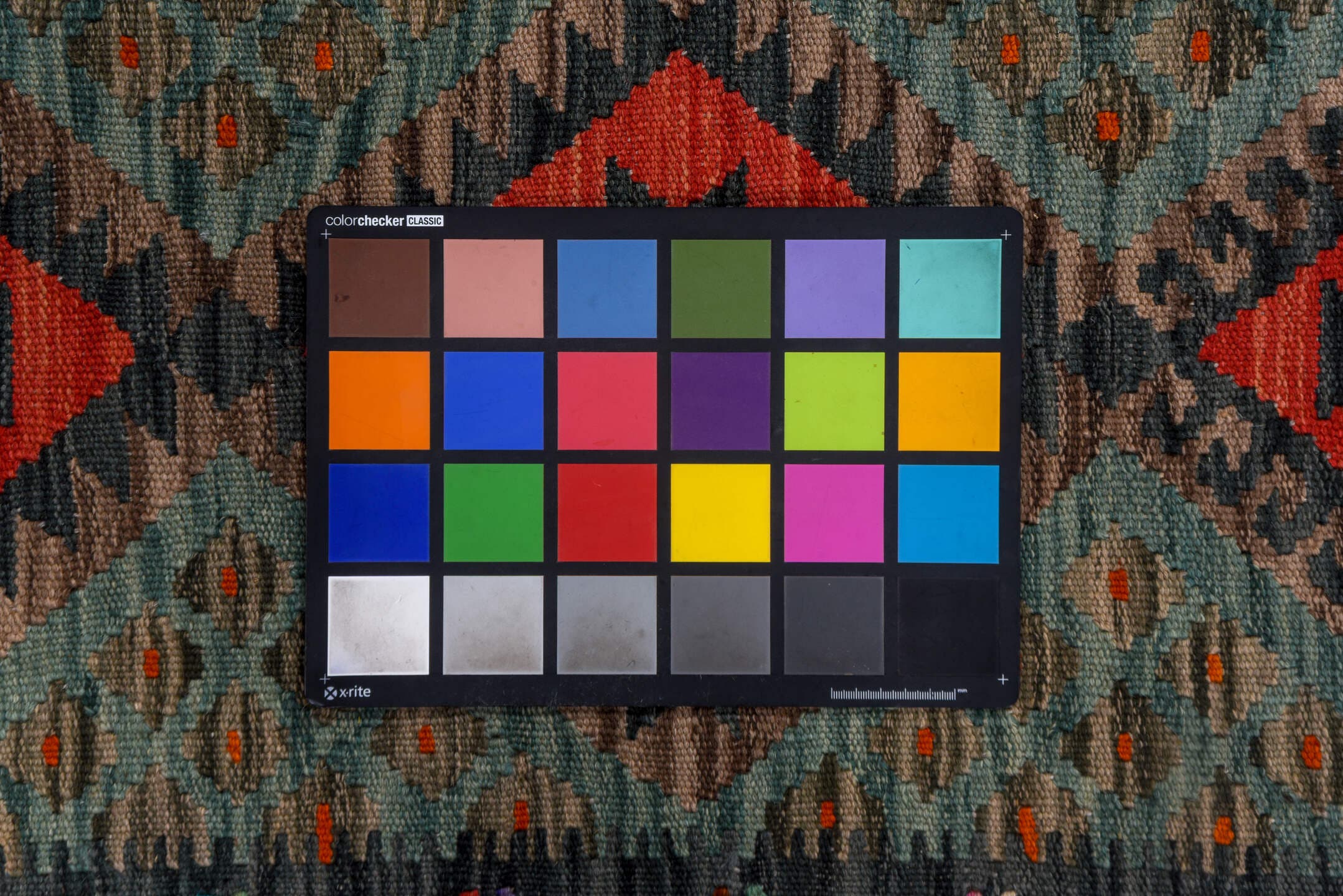2' x 9' one-of-a-kind handmade vintage Kilim runner rug. Color palette: charcoal, crimson, turquoise, coral, ivory, lavender