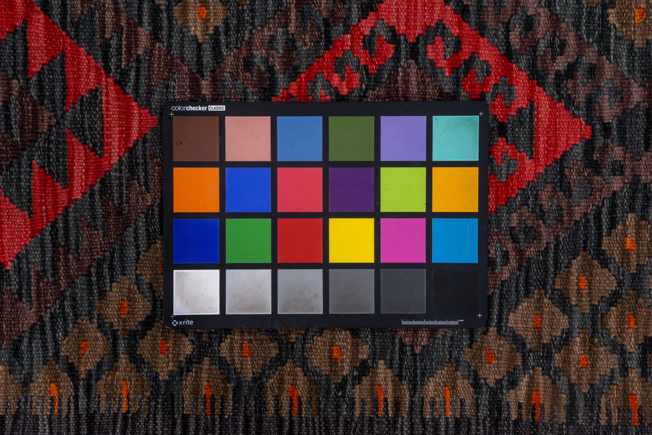 2' x 9' one-of-a-kind handmade vintage Kilim runner rug. Color palette: black, blue, brown, gray, pink, red, yellow