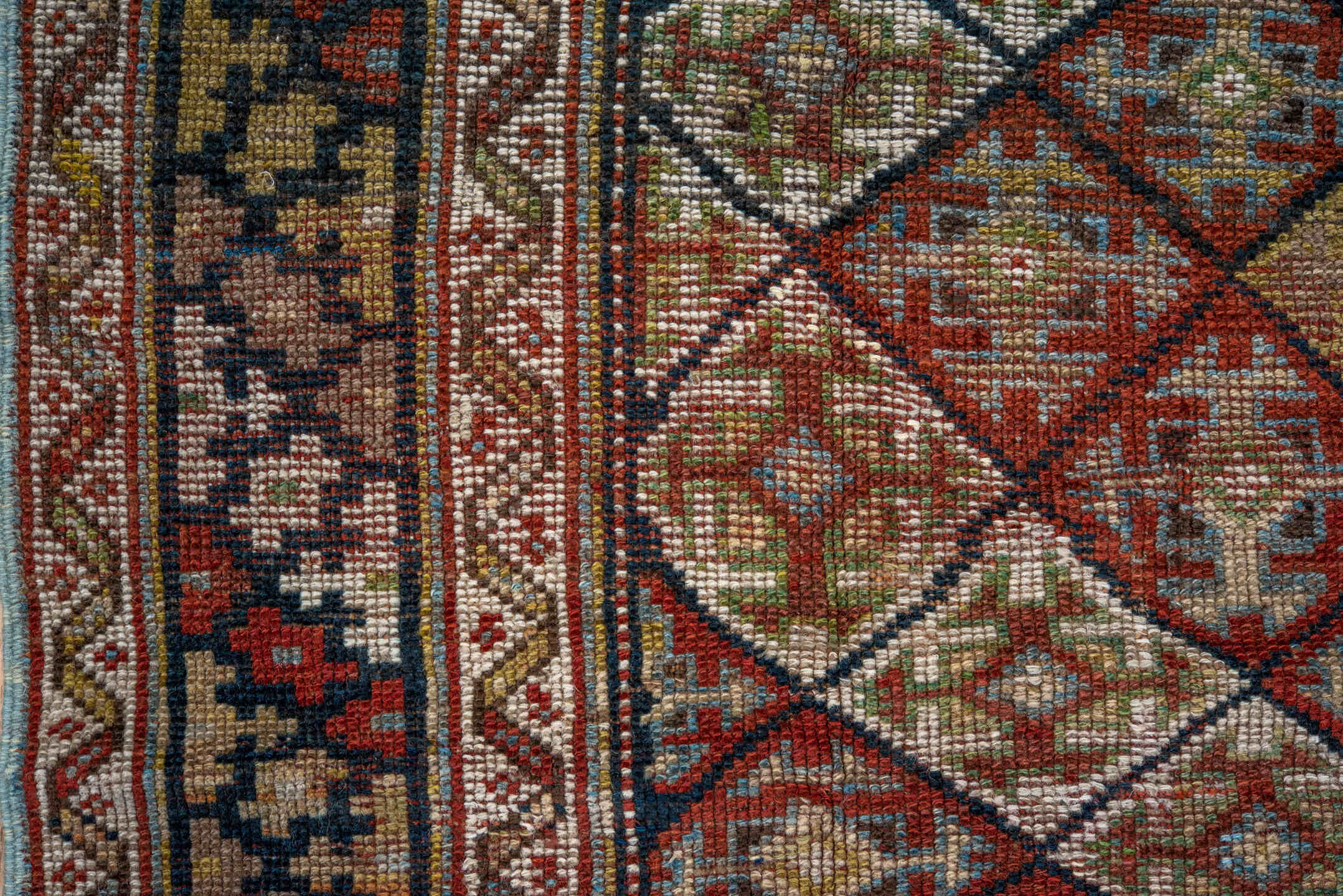 4' x 8' one-of-a-kind handmade antique Kurd rug. Color palette: camel, ivory, rust, sky blue, navy, taupe, gold, brown