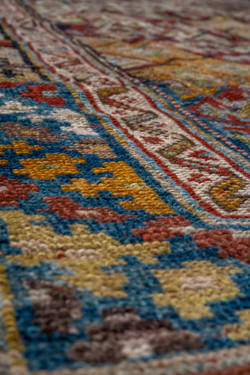 4' x 8' one-of-a-kind handmade antique Kurd rug. Color palette: camel, ivory, rust, sky blue, navy, taupe, gold, brown