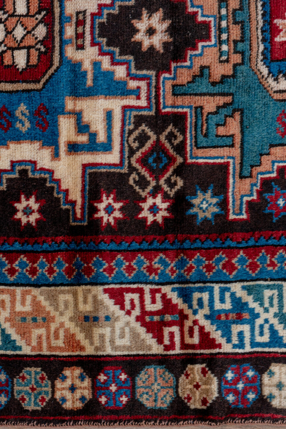 3' x 5' one-of-a-kind handmade antique Caucasian small size rug. Color palette: ivory, brown, sky blue, crimson, navy, rose