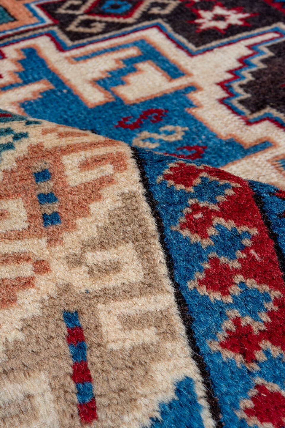 3' x 5' one-of-a-kind handmade antique Caucasian small size rug. Color palette: ivory, brown, sky blue, crimson, navy, rose