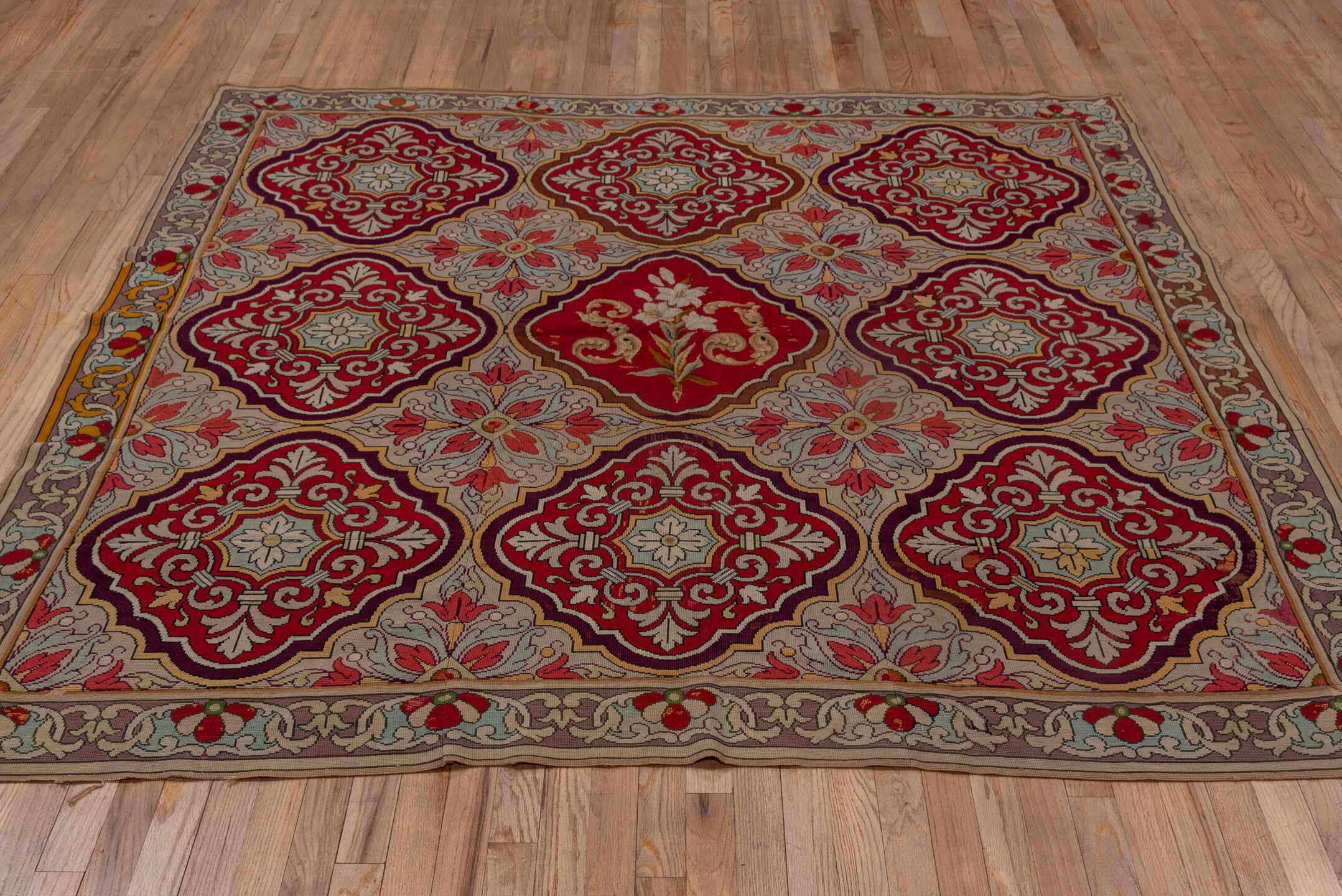 6' x 6' one-of-a-kind handmade vintage Needlepoint rug. Color palette: brown, gray, red