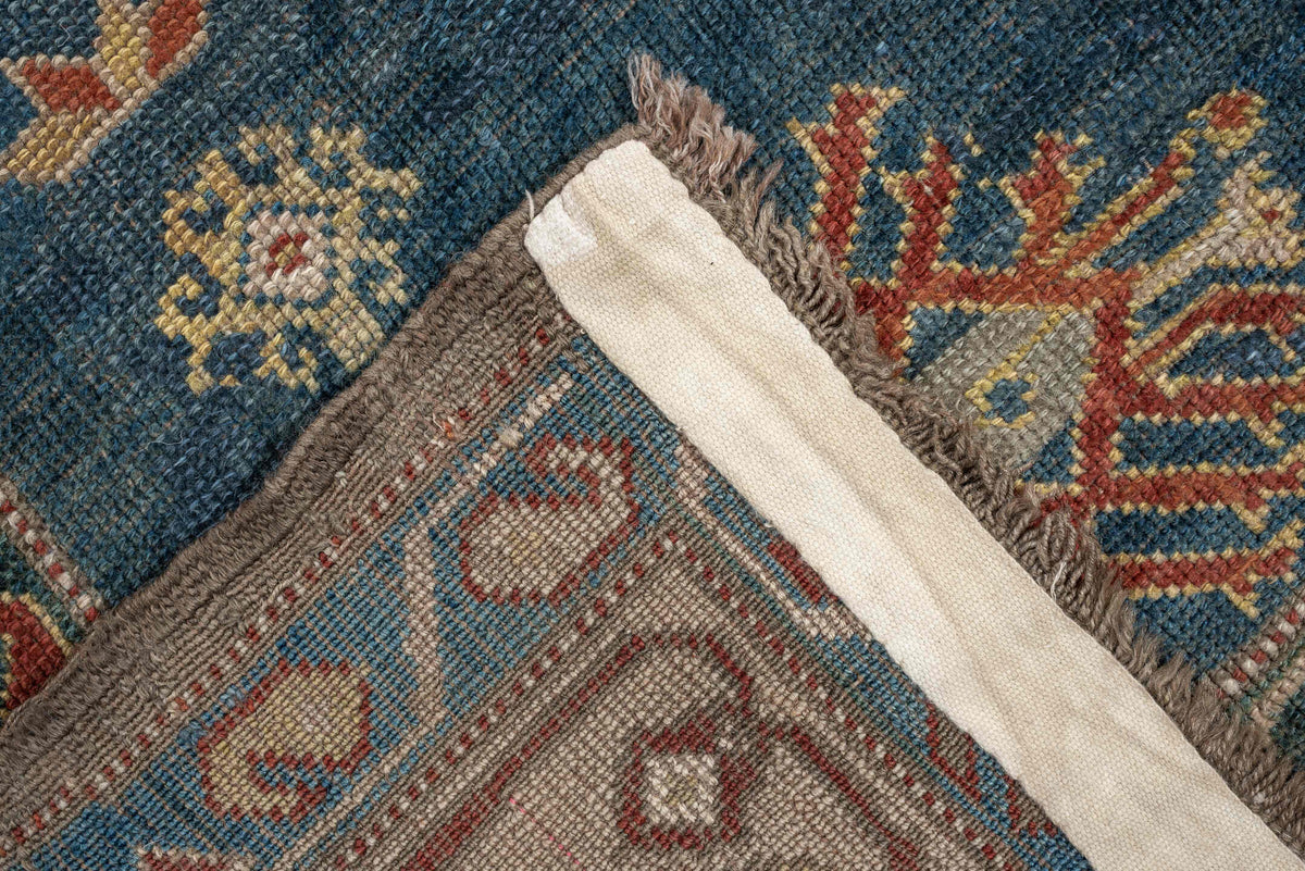 5' x 8' one-of-a-kind handmade antique Caucasian medium size rug. Color palette: teal, rust, ivory, taupe, terracotta, ochre