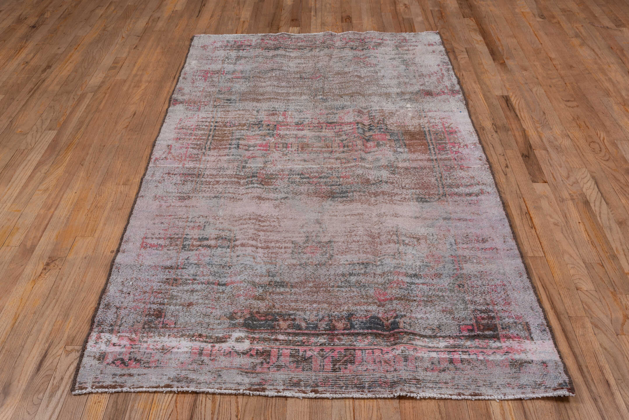 4' x 8' one-of-a-kind handmade vintage Overdyed rug. Color palette: ivory, blush, taupe, charcoal, rose, brown, pink, beige