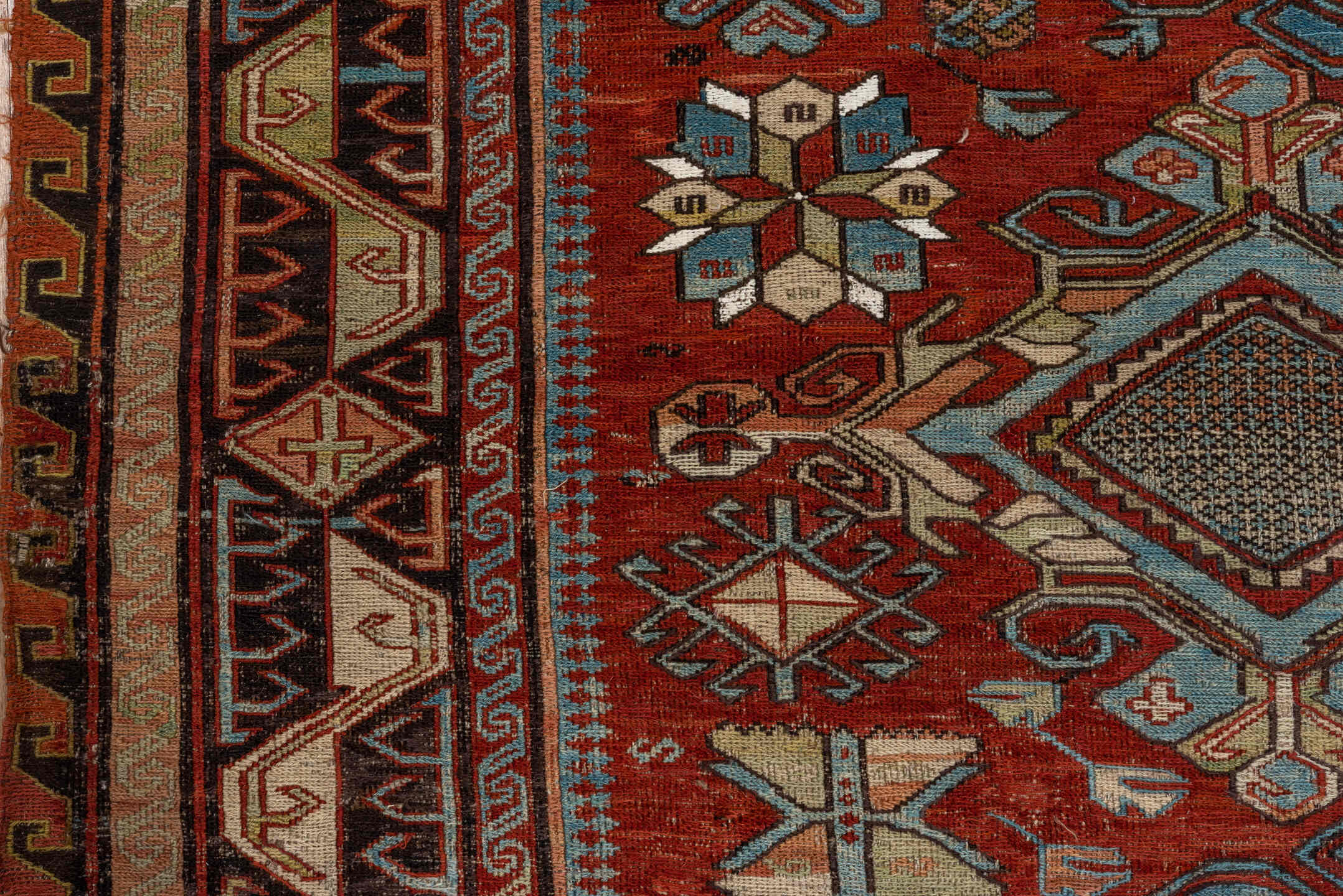6' x 8' one-of-a-kind handmade antique Sumak medium size rug. Color palette: rust, sky blue, ivory, charcoal, camel