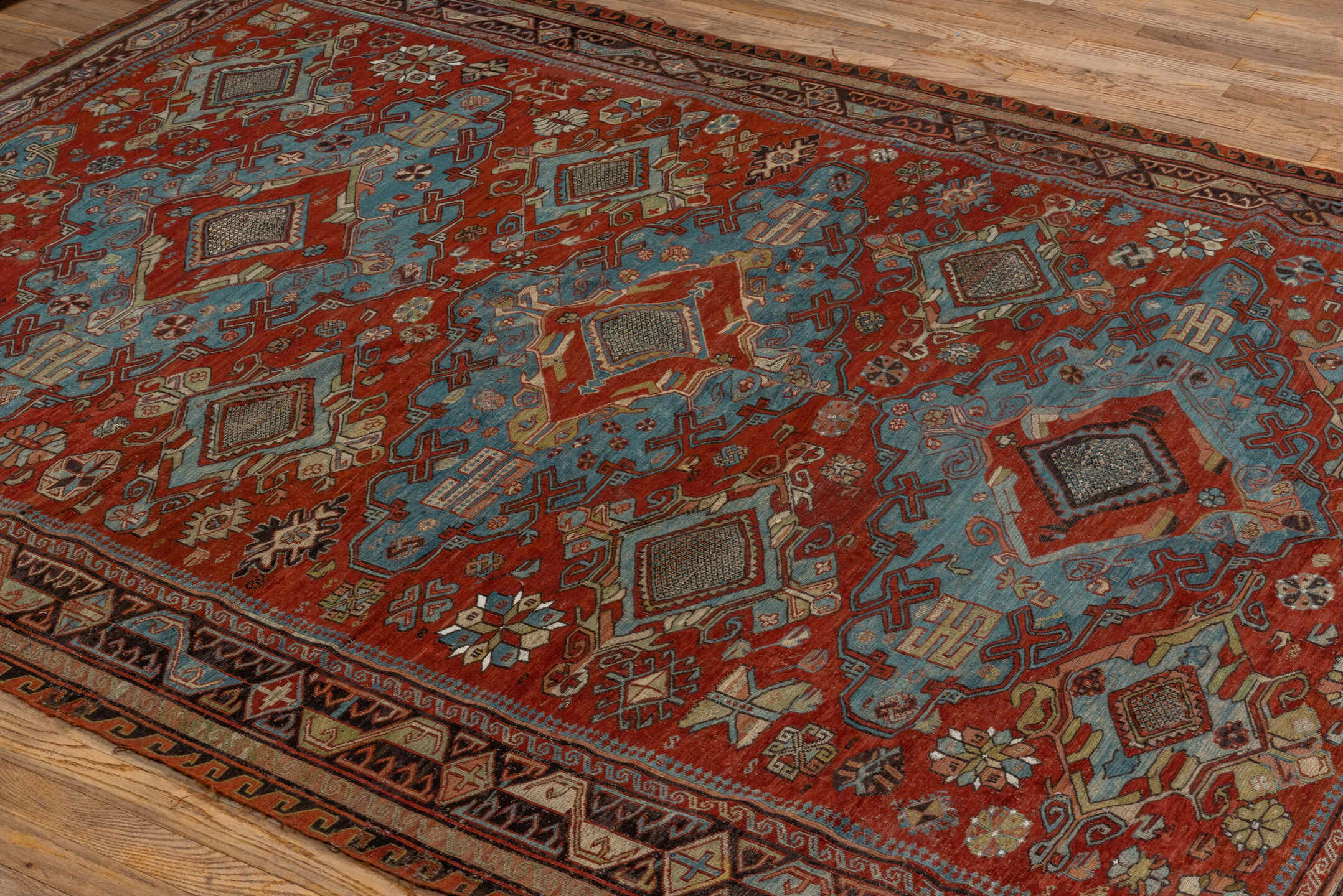 6' x 8' one-of-a-kind handmade antique Sumak medium size rug. Color palette: rust, sky blue, ivory, charcoal, camel