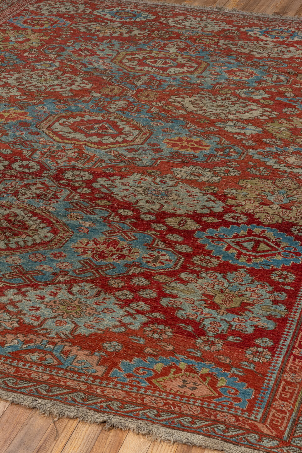7' x 9' one-of-a-kind handmade antique Sumak rug. Color palette: rust, sky blue, ivory, beige, gold, brick, taupe