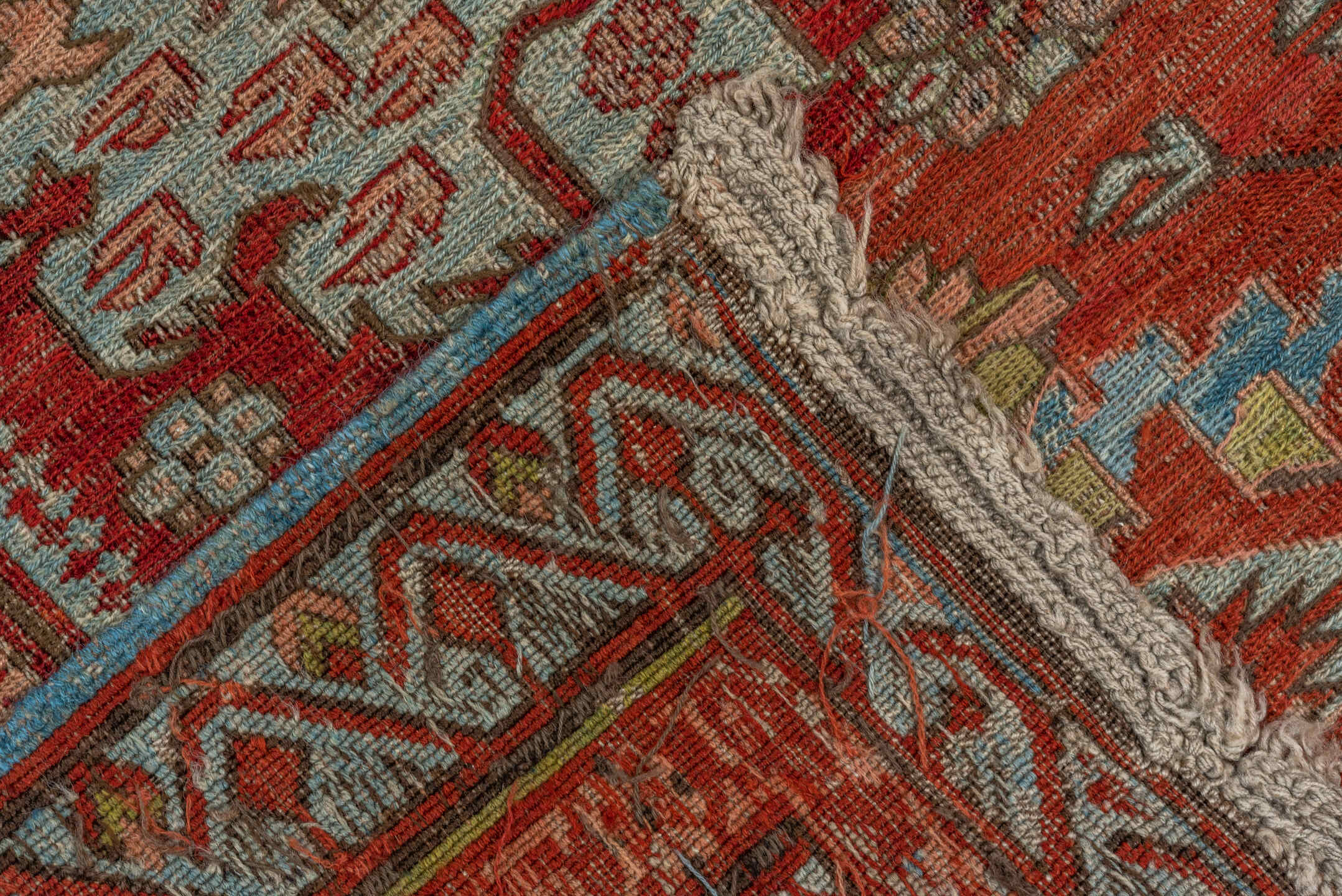 7' x 9' one-of-a-kind handmade antique Sumak rug. Color palette: rust, sky blue, ivory, beige, gold, brick, taupe