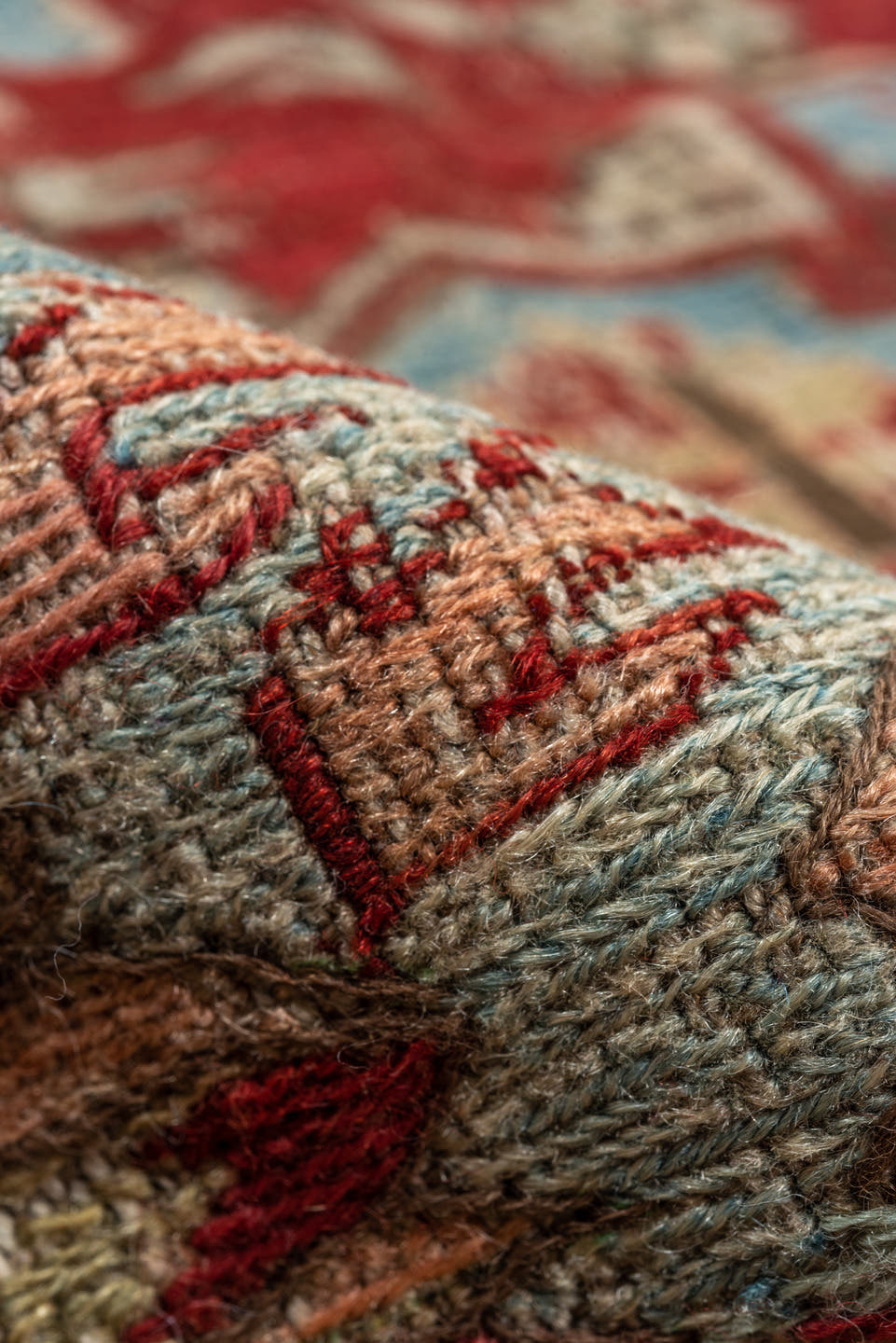 7' x 9' one-of-a-kind handmade antique Sumak rug. Color palette: rust, sky blue, ivory, beige, gold, brick, taupe