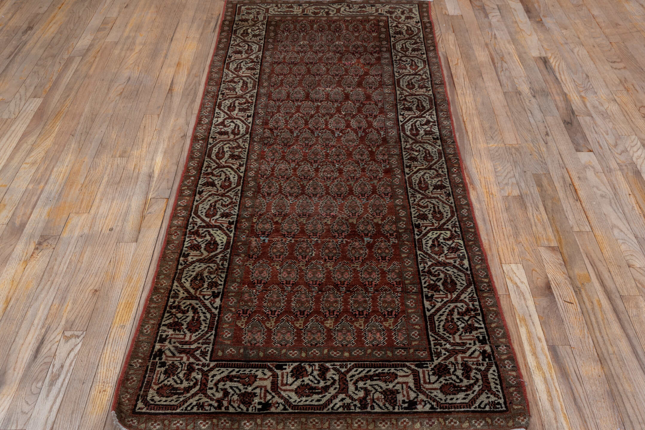 3' x 8' one-of-a-kind handmade vintage Saraband runner rug. Color palette: black, brown, gray, light gray, off-white, pink