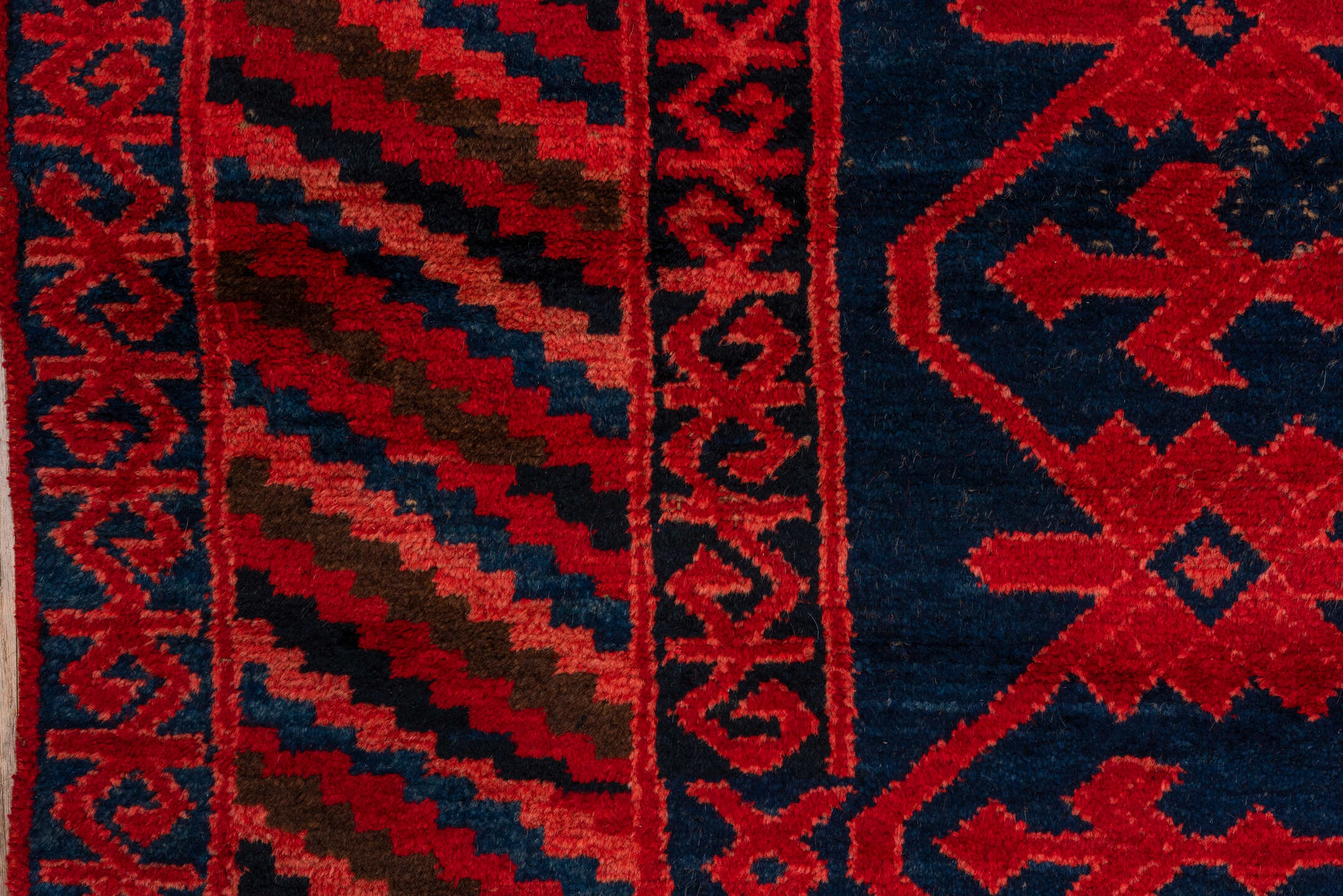 4' x 10' one-of-a-kind handmade vintage Khotan runner rug. Color palette: black, brown, pink, red