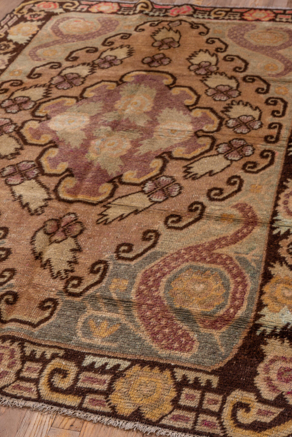 4' x 6' one-of-a-kind handmade antique Khotan small size rug. Color palette: camel, brown, ivory, rose, pale blue, gold