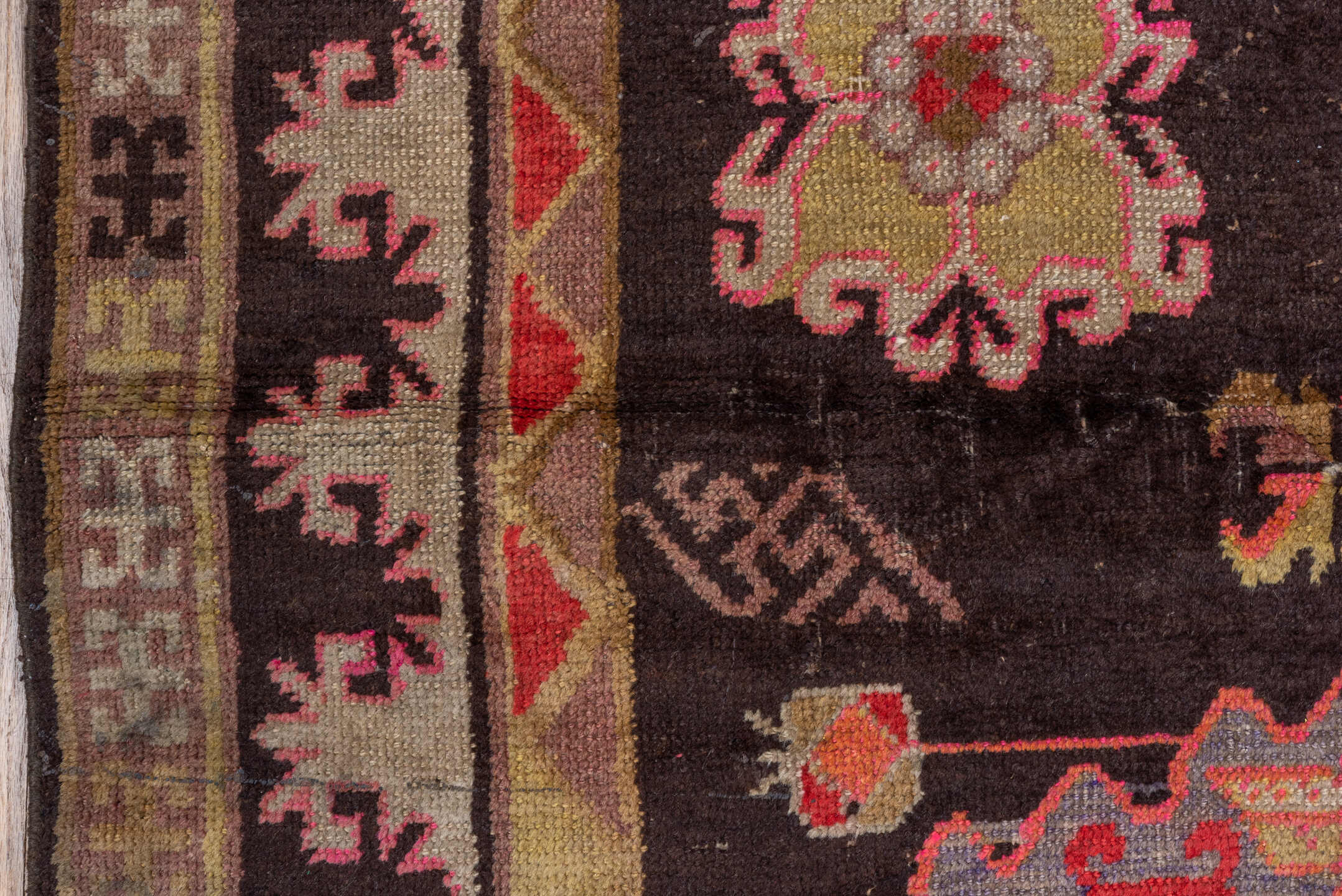 5' x 8' one-of-a-kind handmade antique Khotan medium size rug. Color palette: charcoal, camel, ivory, rose, rust, taupe