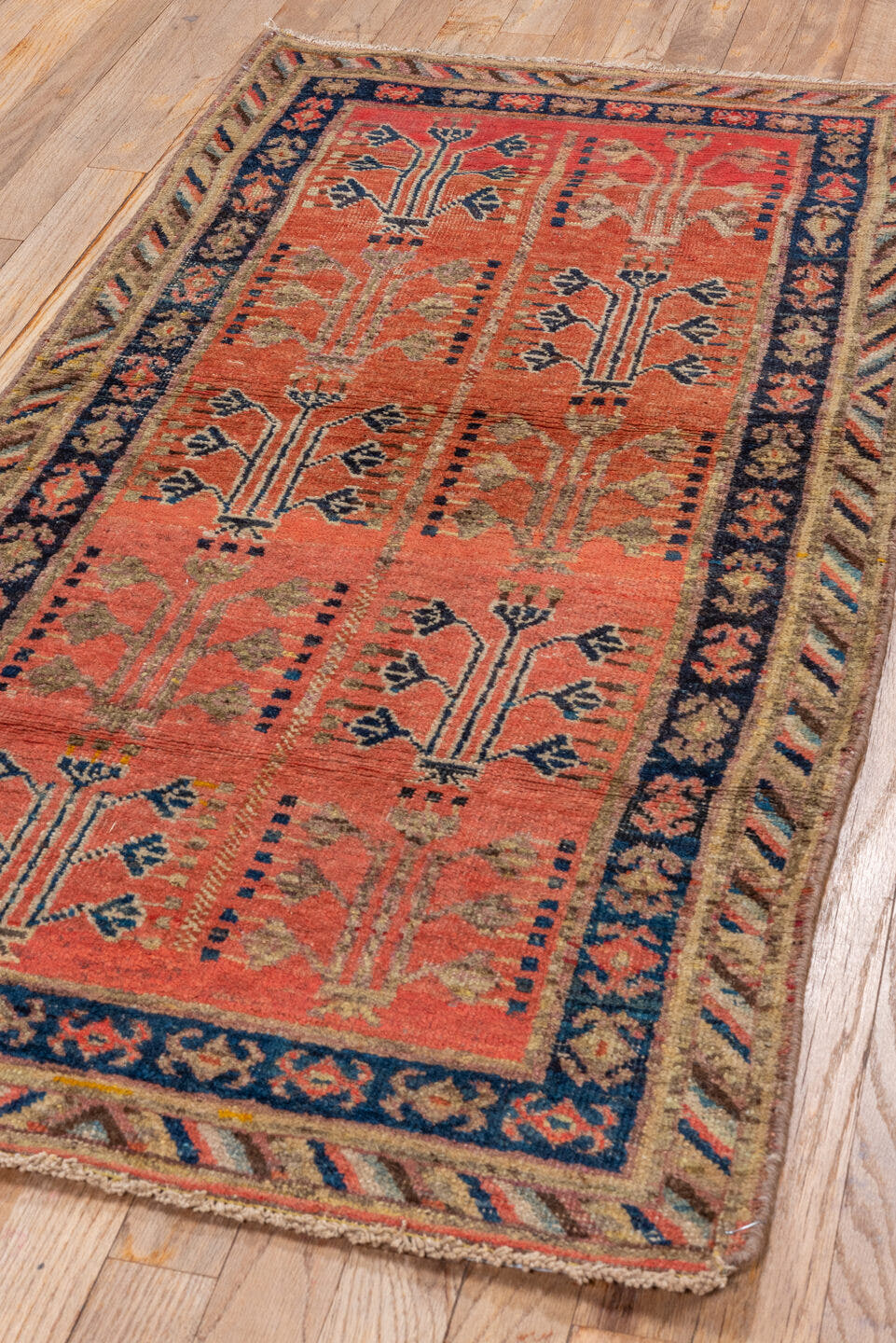 2' x 4' one-of-a-kind handmade antique Khotan small size rug. Color palette: coral, navy, camel, ivory, terra cotta, slate