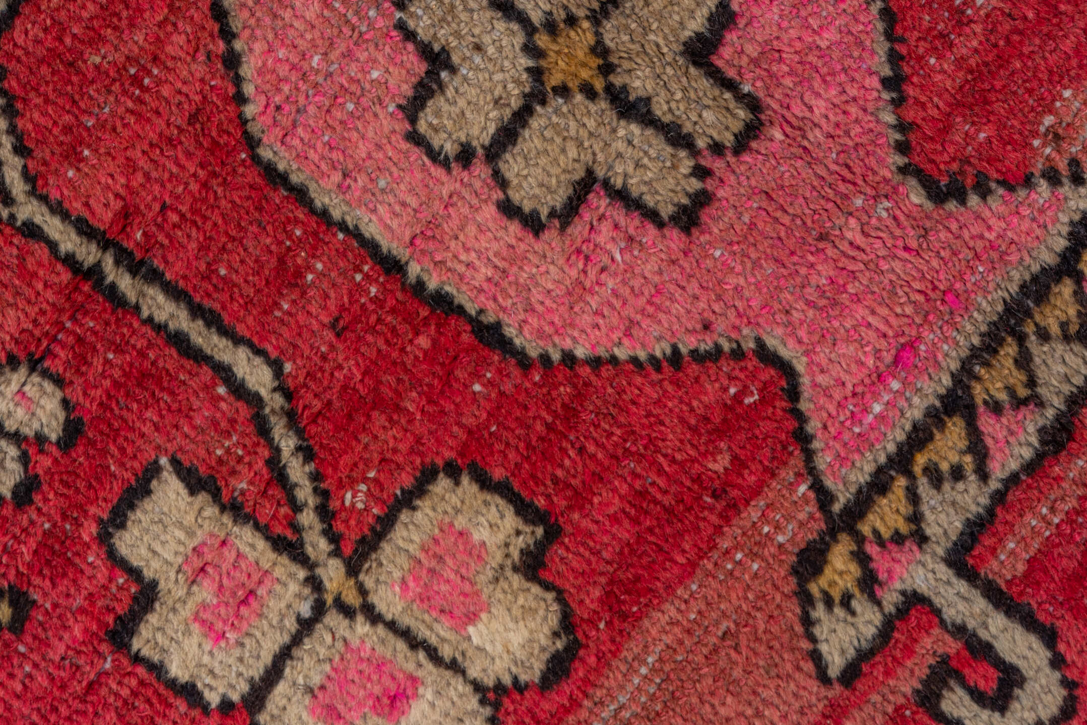 4' x 8' one-of-a-kind handmade vintage Khotan rug. Color palette: black, brown, pink, red