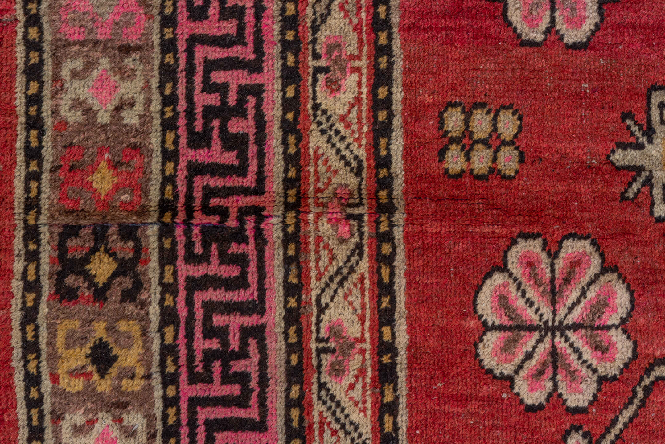 4' x 8' one-of-a-kind handmade antique Khotan rug. Color palette: raspberry, rose, taupe, ivory, charcoal, burgundy, camel