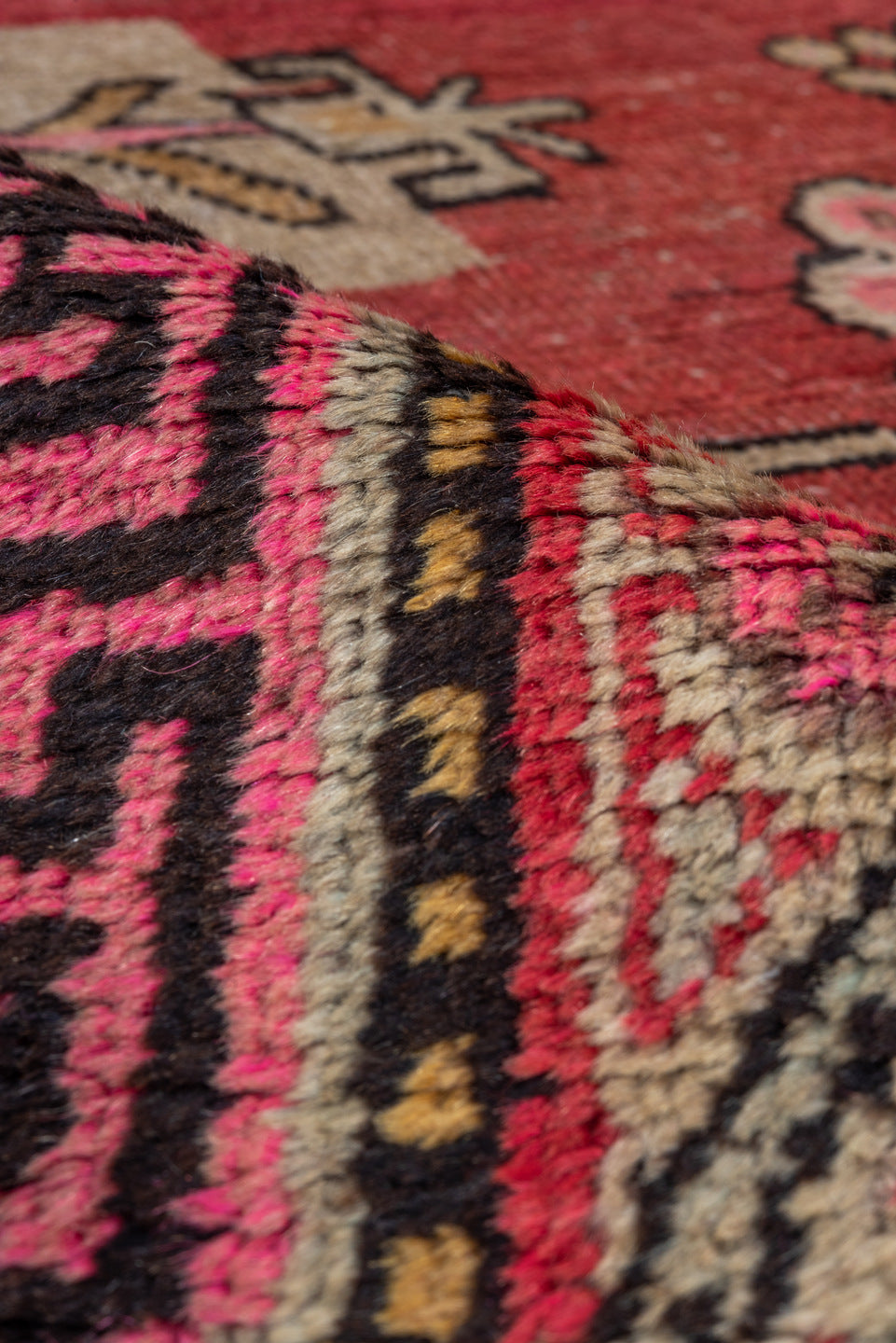 4' x 8' one-of-a-kind handmade vintage Khotan rug. Color palette: black, brown, pink, red