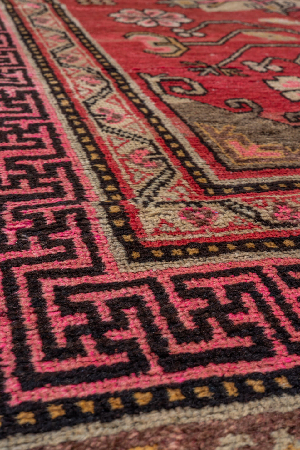 4' x 8' one-of-a-kind handmade antique Khotan rug. Color palette: raspberry, rose, taupe, ivory, charcoal, burgundy, camel