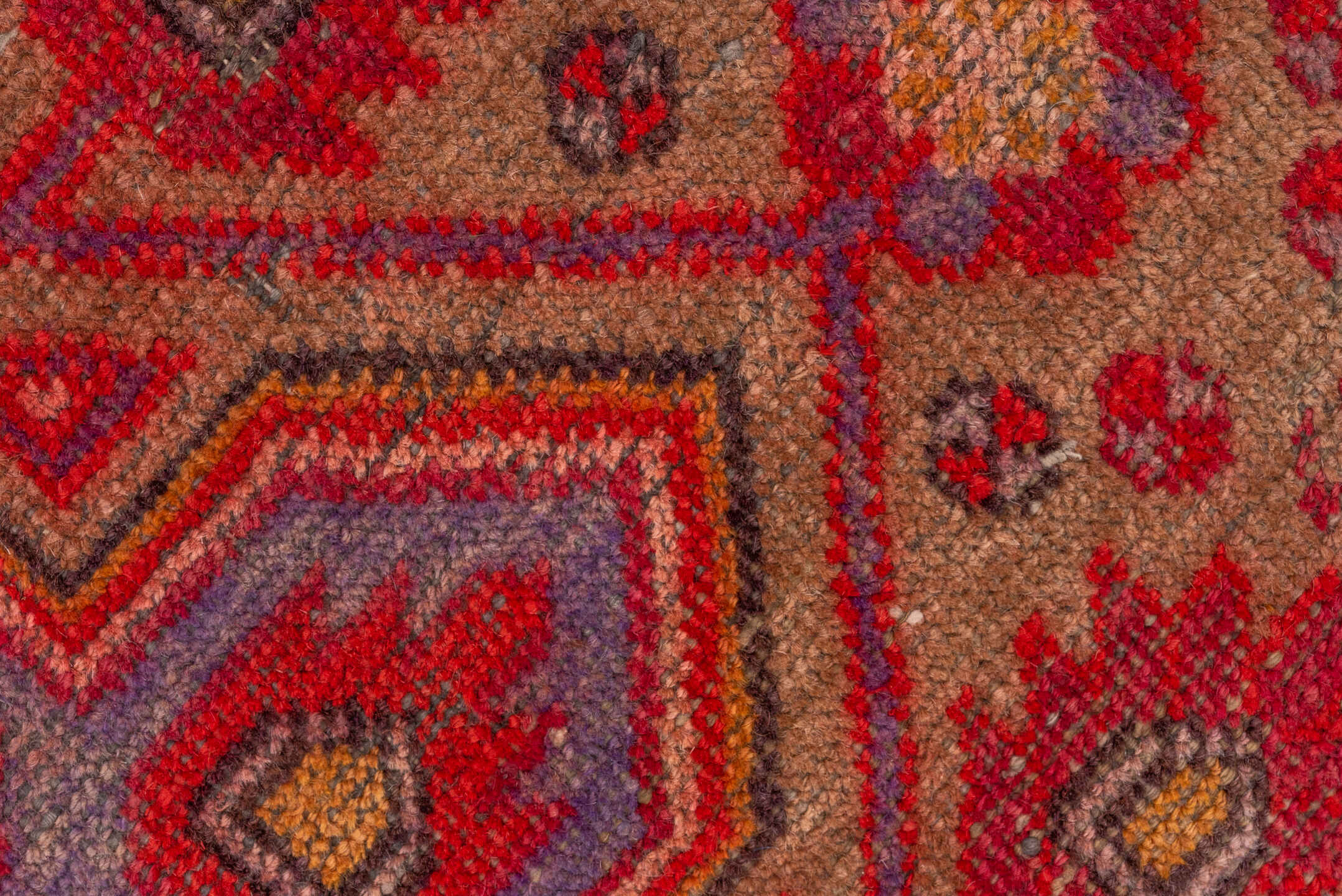5' x 12' one-of-a-kind handmade vintage Khotan rug. Color palette: brown, fire brick, pink, red, redwood, wine