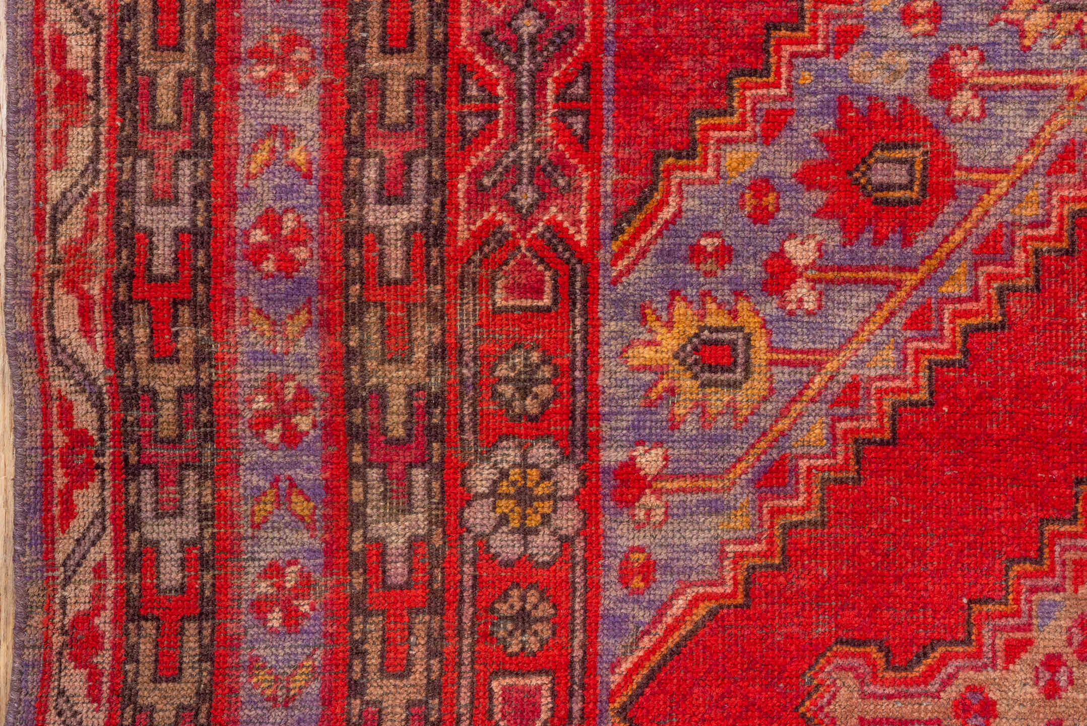 5' x 12' one-of-a-kind handmade vintage Khotan rug. Color palette: brown, fire brick, pink, red, redwood, wine