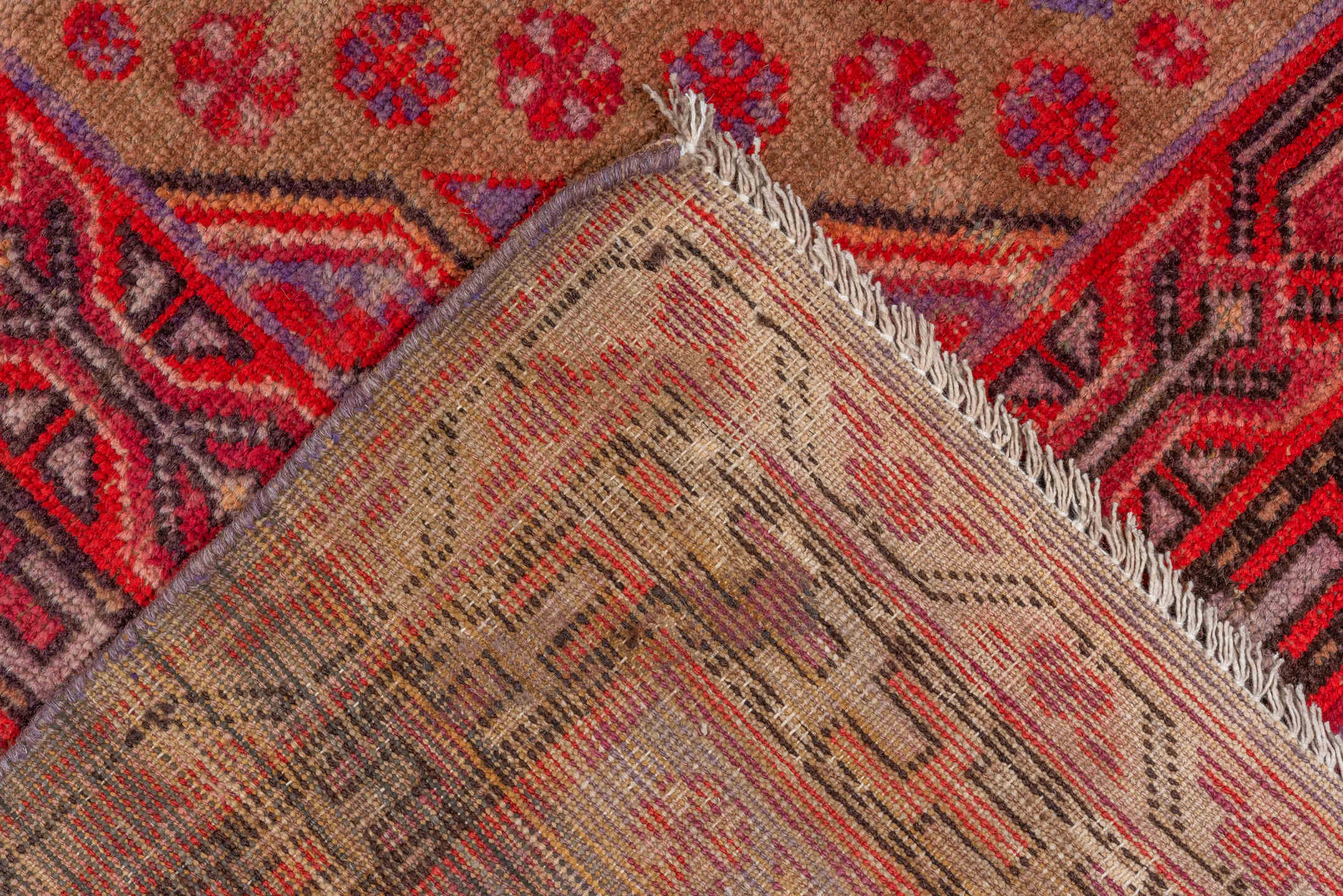 5' x 12' one-of-a-kind handmade vintage Khotan rug. Color palette: brown, fire brick, pink, red, redwood, wine