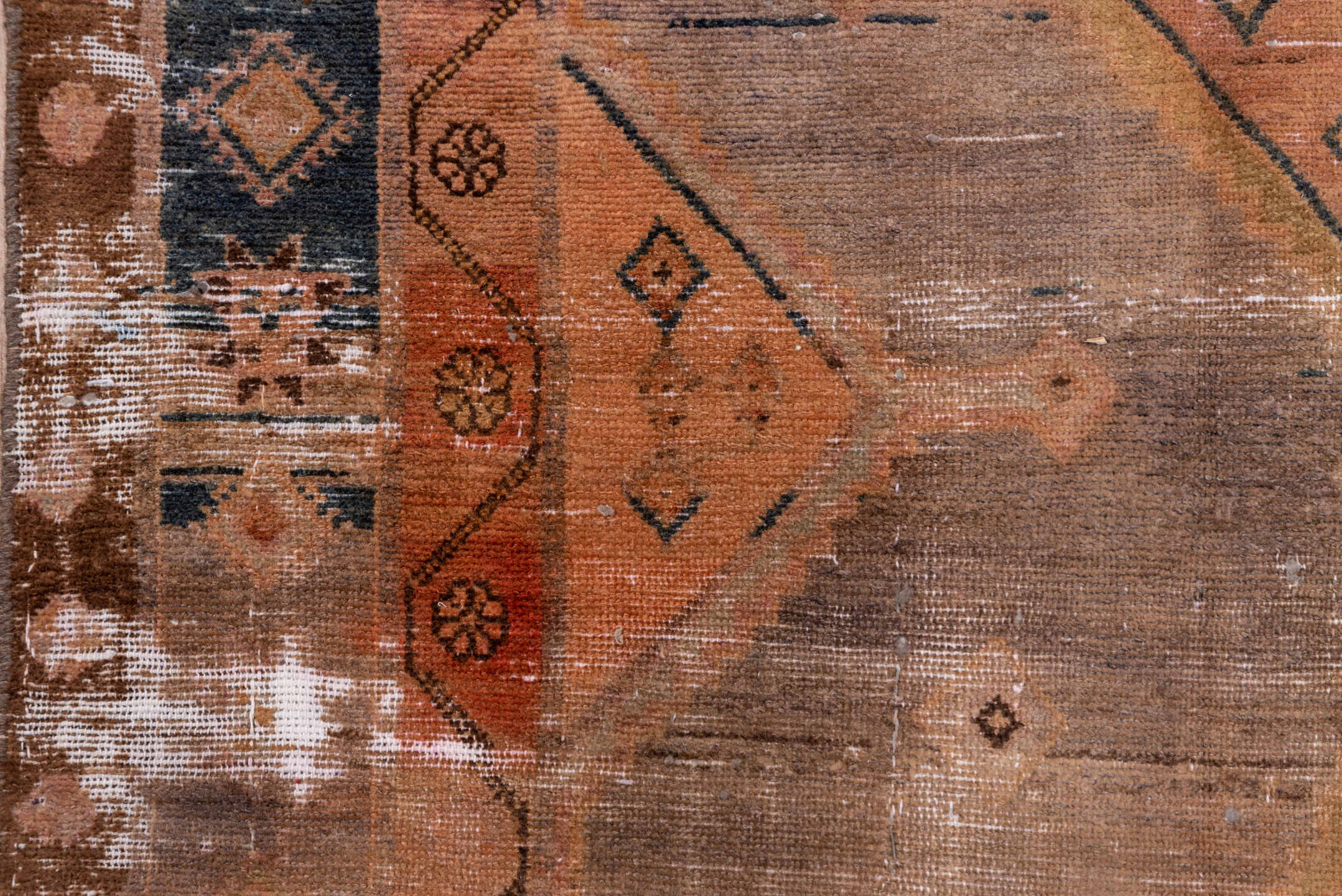 4' x 9' one-of-a-kind handmade vintage Distressed runner rug. Color palette: taupe, terra cotta, brown, charcoal, camel