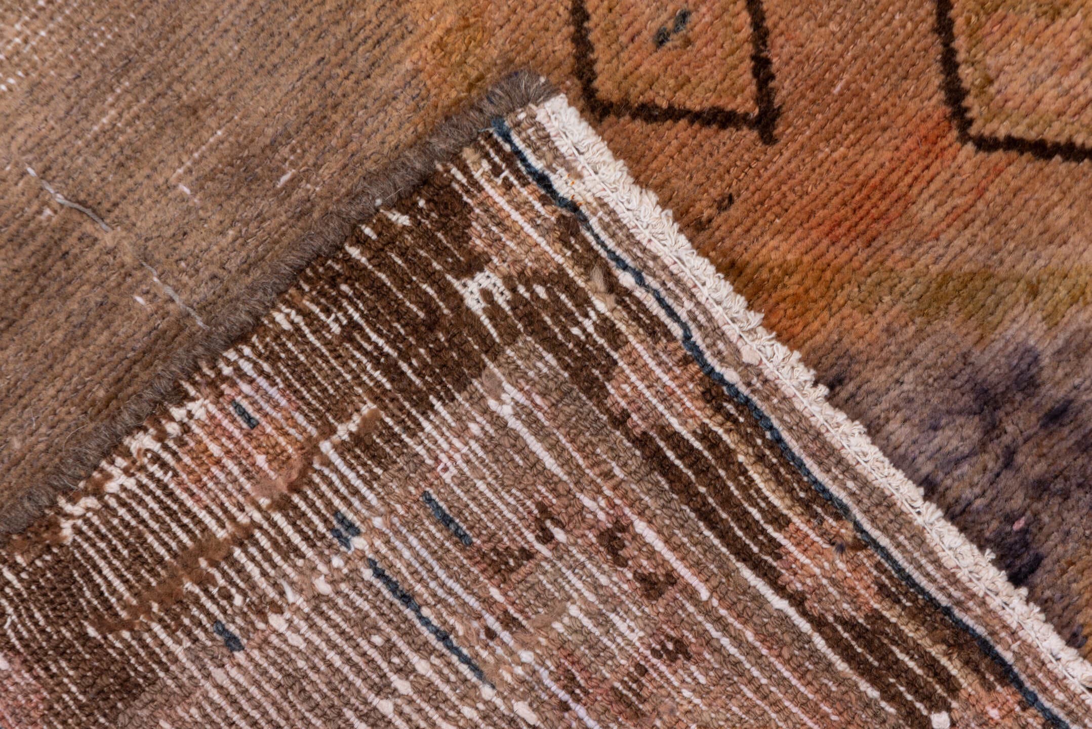 4' x 9' one-of-a-kind handmade vintage Distressed runner rug. Color palette: taupe, terra cotta, brown, charcoal, camel