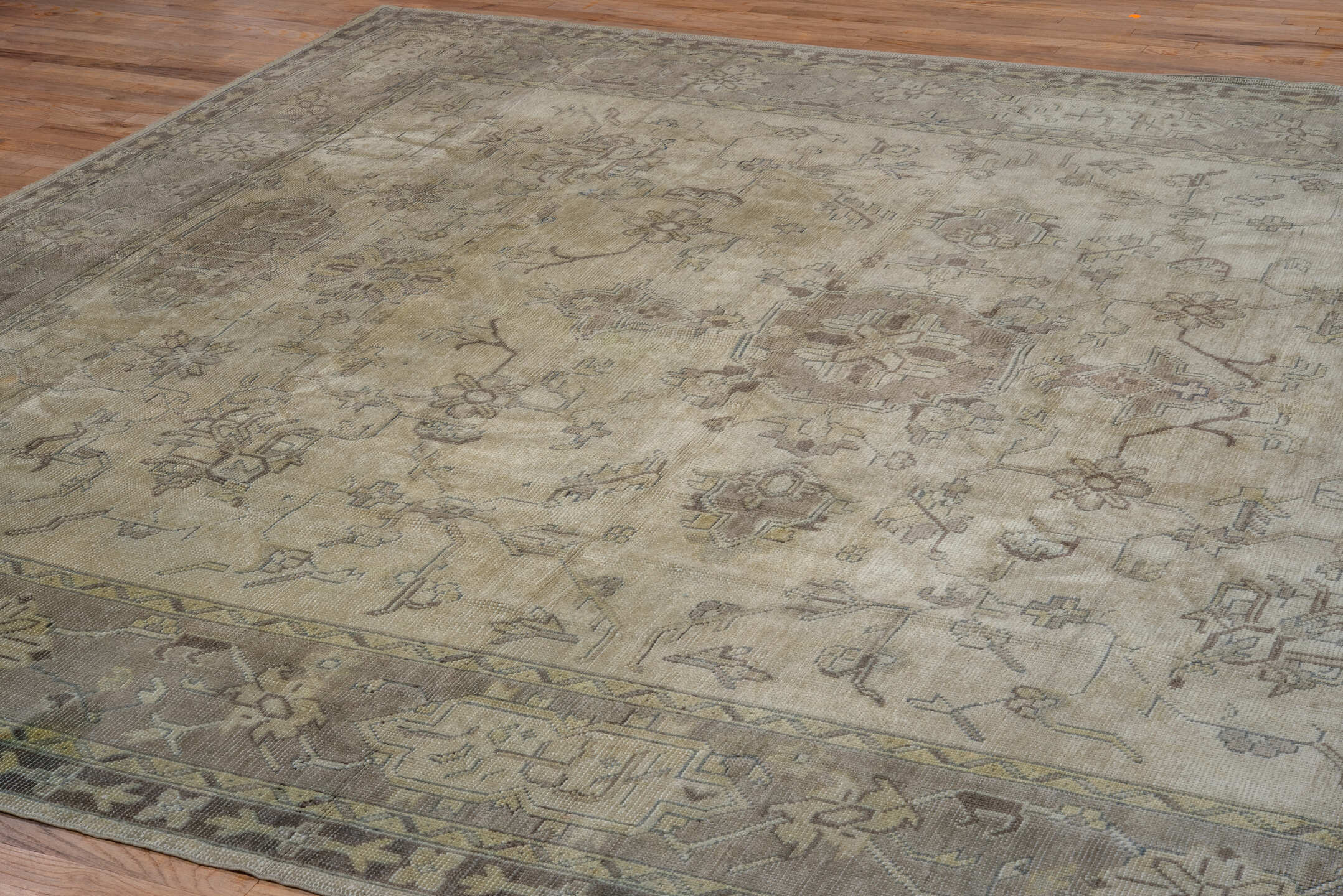 9' x 12' one-of-a-kind handmade antique Oushak large size rug. Color palette: ivory, taupe, beige, brown, pale blue, camel
