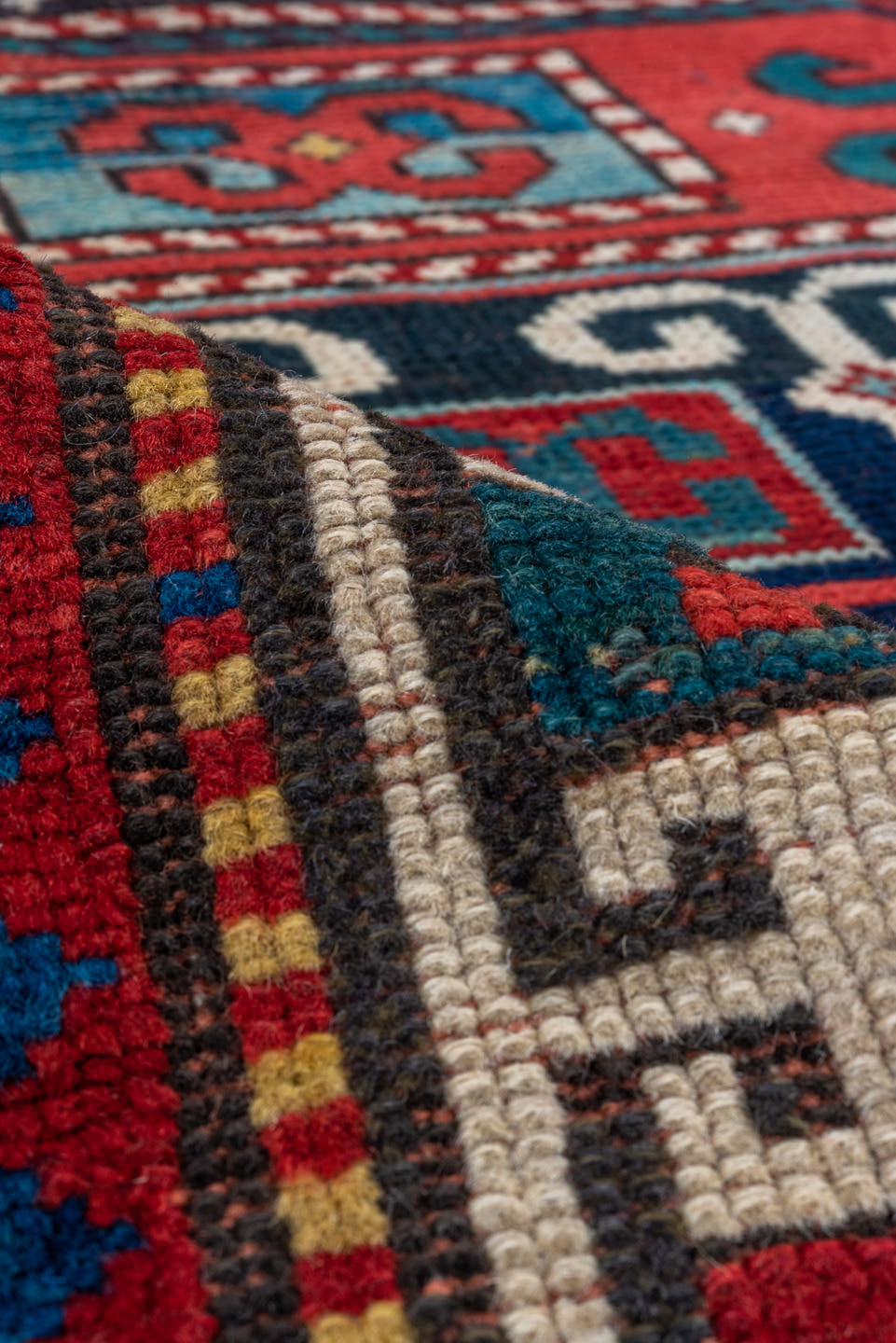 4' x 4' one-of-a-kind handmade antique Kazak small size rug. Color palette: ivory, red, navy, cobalt, teal, crimson, camel