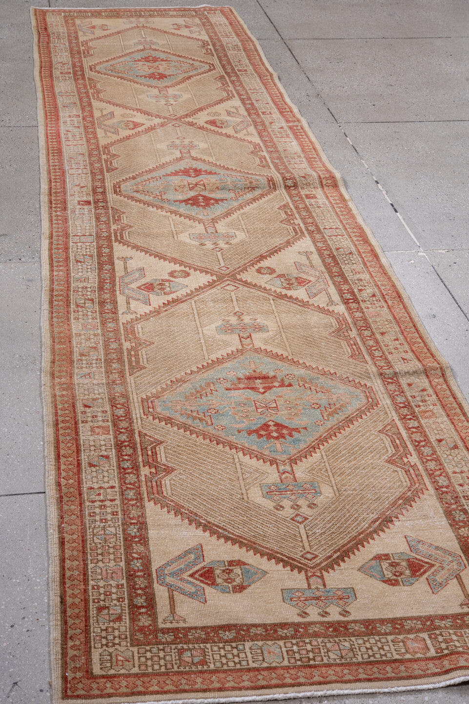 2' x 12' one-of-a-kind handmade antique Sarab runner rug. Color palette: ivory, rust, sky blue, camel, terra cotta, taupe