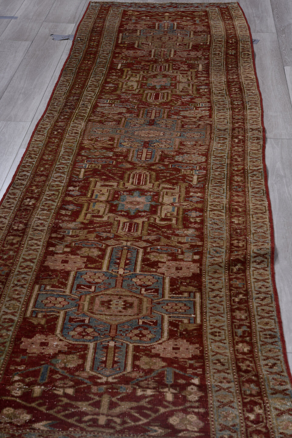 3' x 11' one-of-a-kind handmade antique Karaje runner rug. Color palette: rust, ivory, sky_blue, taupe, camel, slate