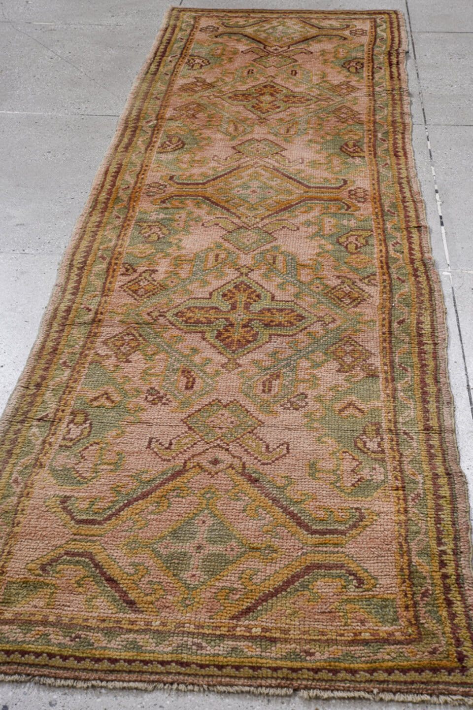 3' x 11' one-of-a-kind handmade antique Oushak runner rug. Color palette: blush, sage, gold, rust, ivory, taupe, camel, pink