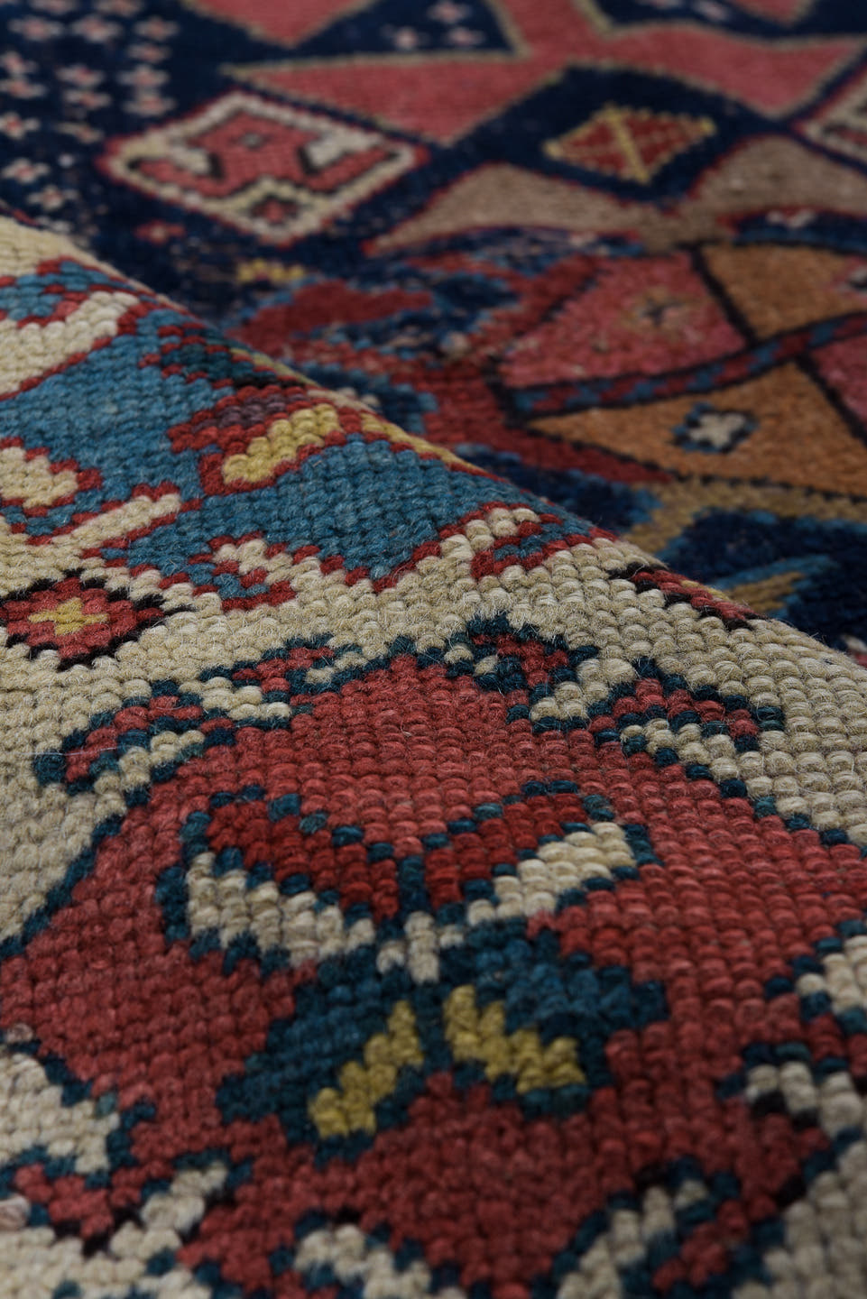 3' x 11' one-of-a-kind handmade vintage Caucasian runner rug. Color palette: navy, ivory, rust, rose, soft blue, taupe