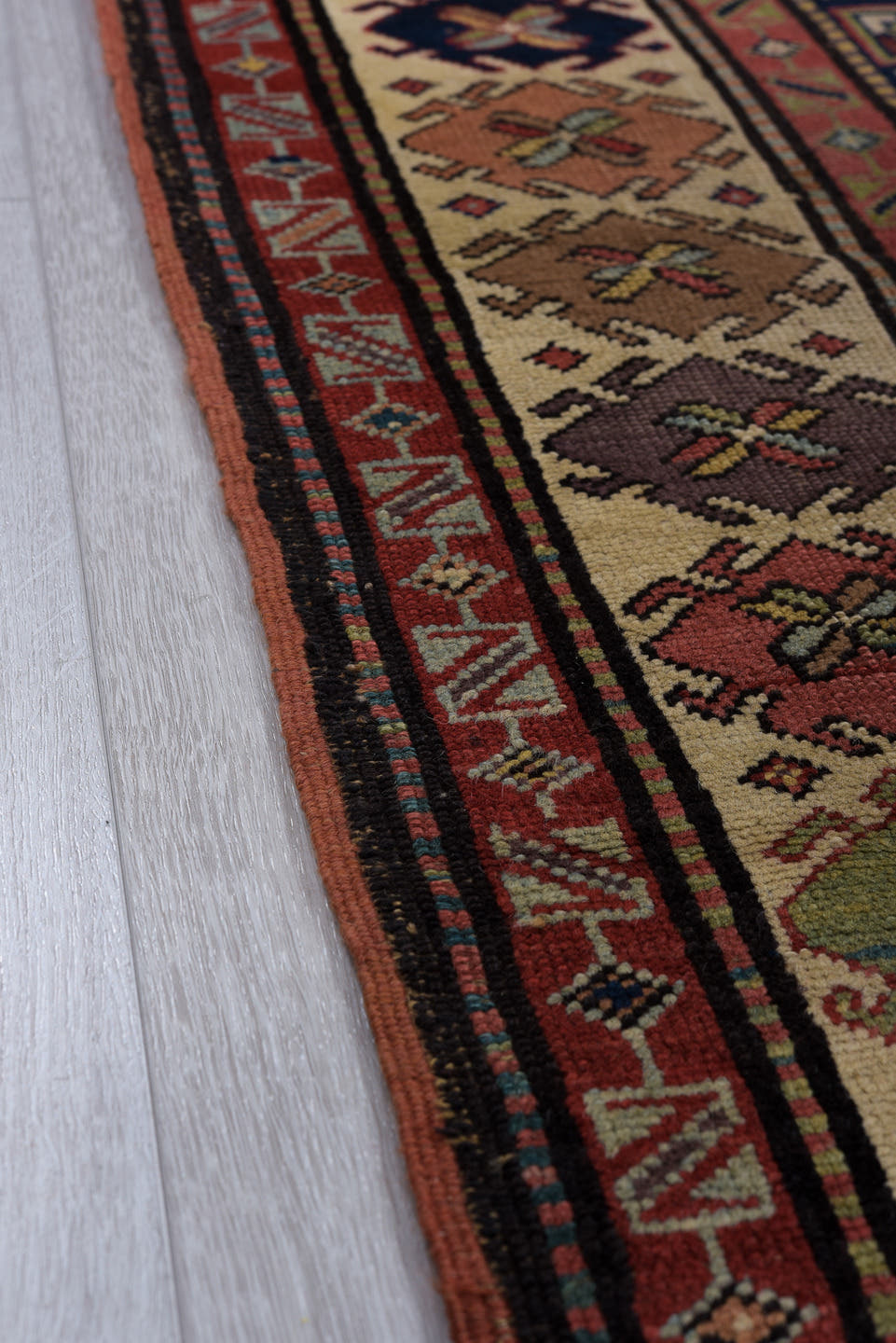 3' x 11' one-of-a-kind handmade vintage Caucasian runner rug. Color palette: navy, ivory, rust, rose, soft blue, taupe