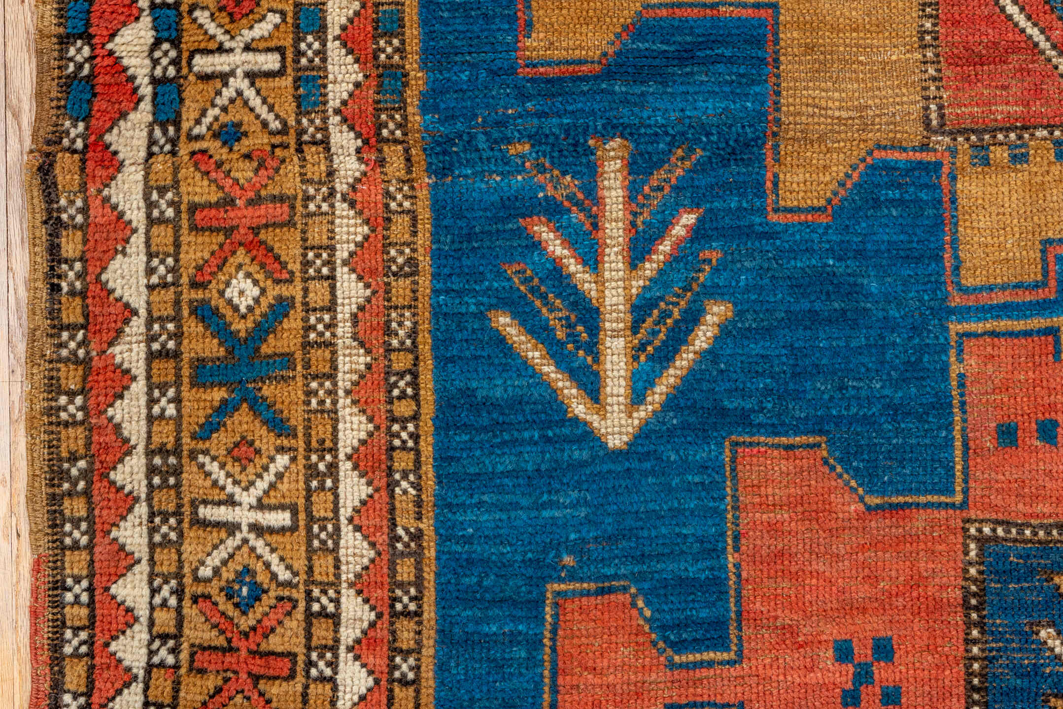 4' x 5' one-of-a-kind handmade antique Kazak small size rug. Color palette: blue, ivory, rust, navy, camel, coral