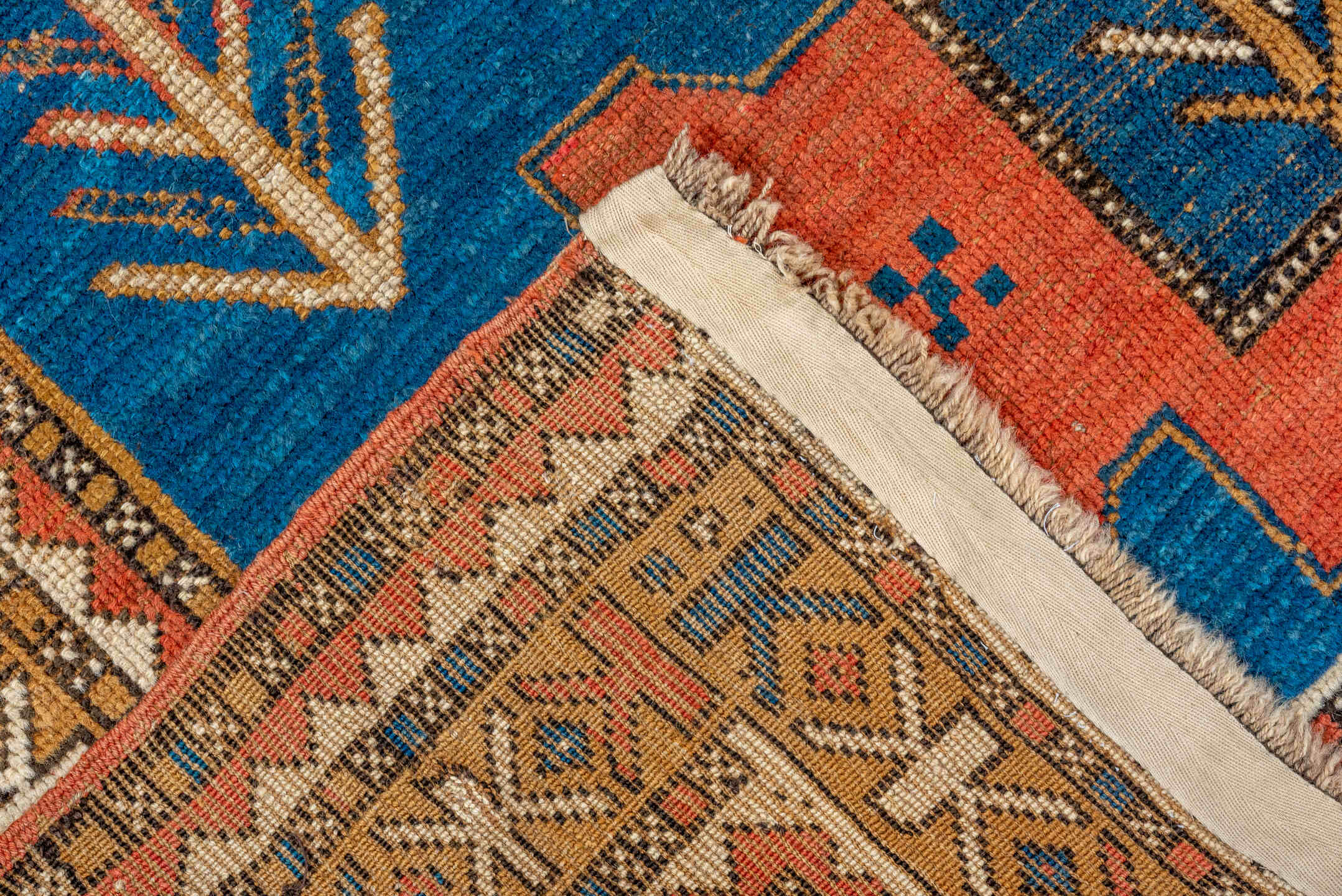 4' x 5' one-of-a-kind handmade antique Kazak small size rug. Color palette: blue, ivory, rust, navy, camel, coral