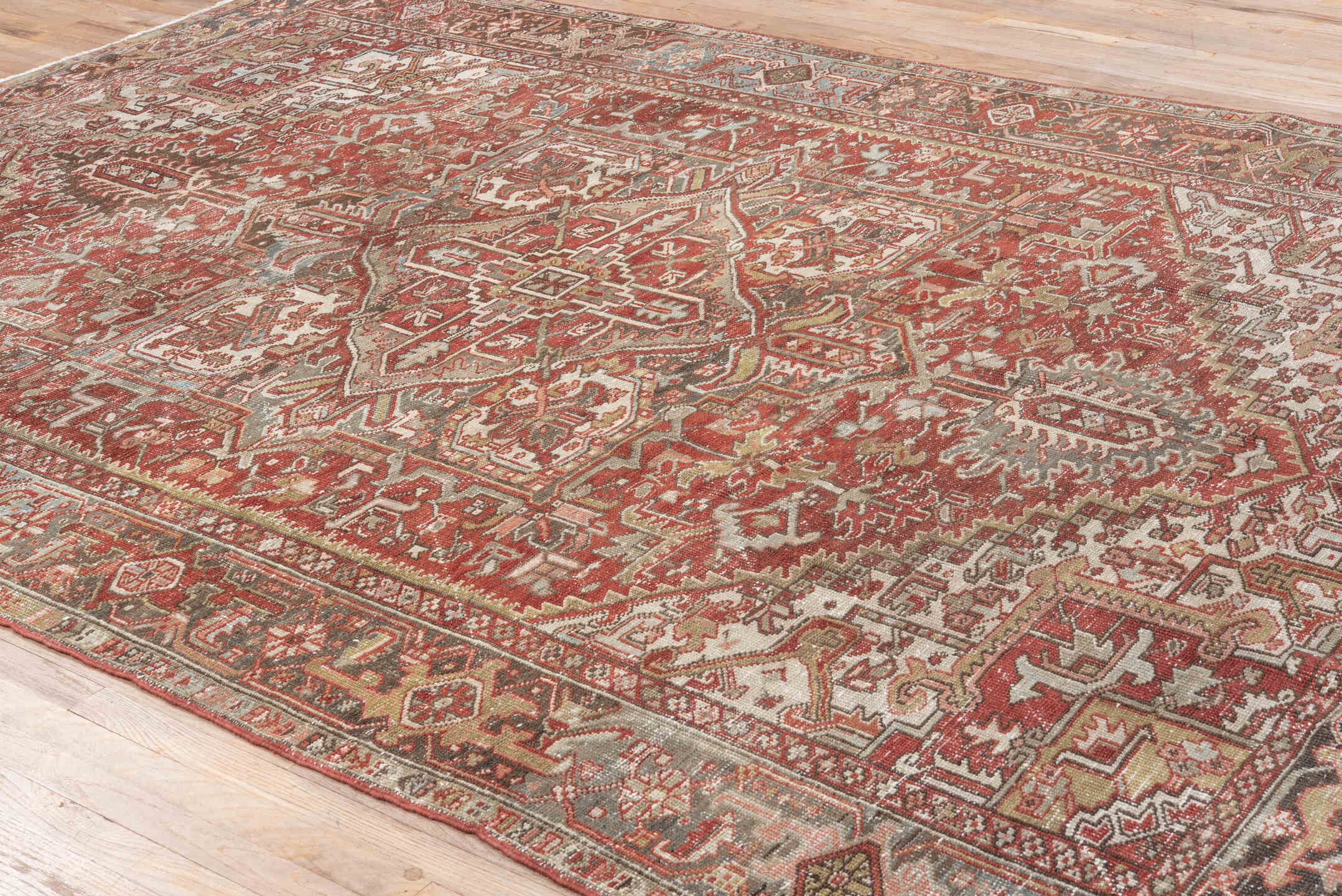 8' x 11' one-of-a-kind handmade antique Heriz large size rug. Color palette: ivory, rust, brick red, taupe, brown
