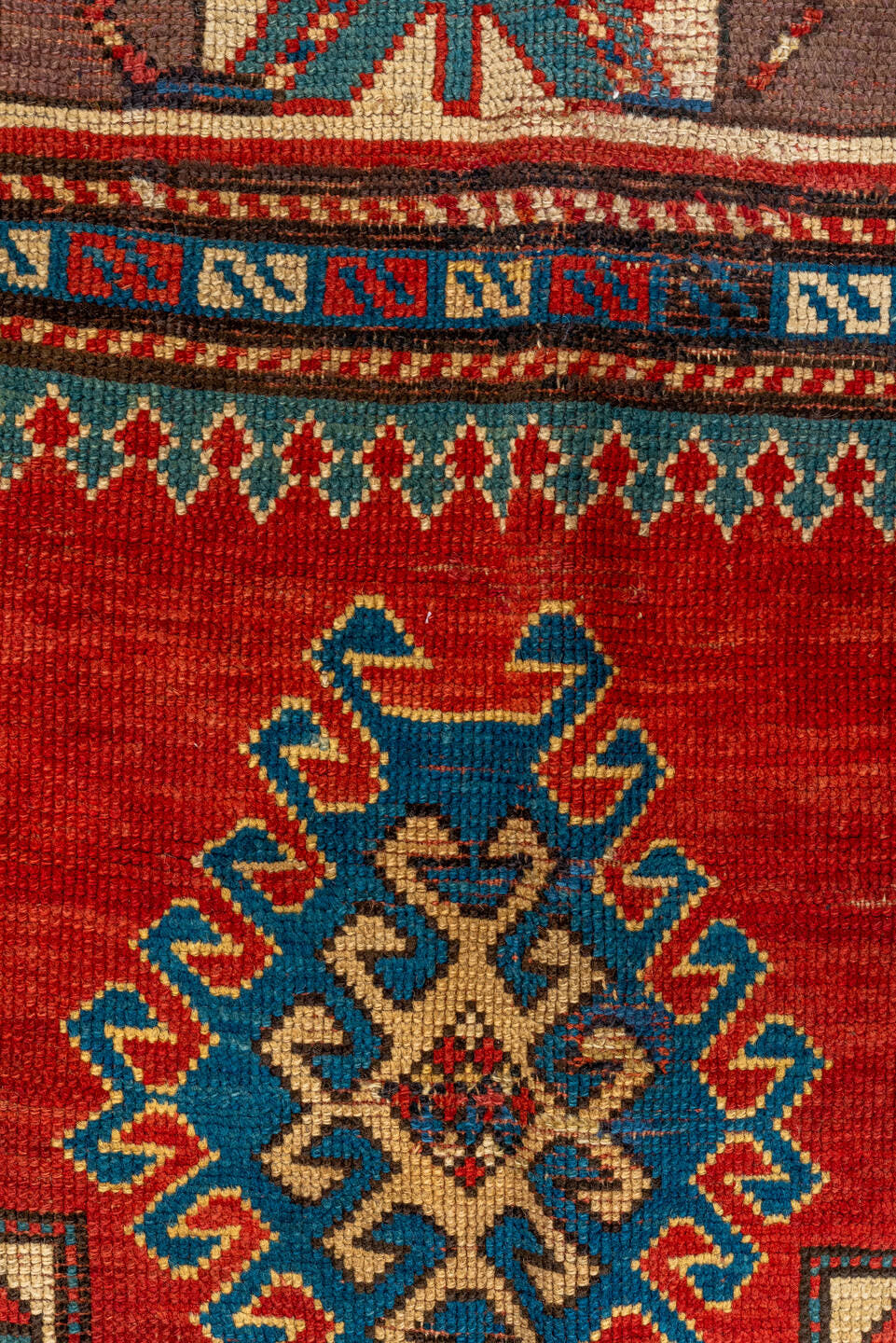 4' x 7' one-of-a-kind handmade antique Kazak rug. Color palette: ivory, red, sky blue, navy, rust, taupe, teal, light blue