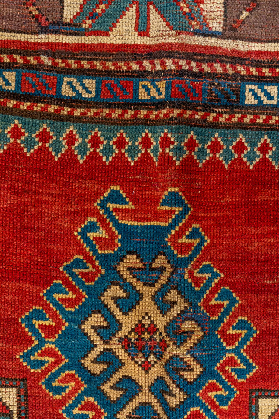 4' x 7' one-of-a-kind handmade antique Kazak rug. Color palette: ivory, red, sky blue, navy, rust, taupe, teal, light blue