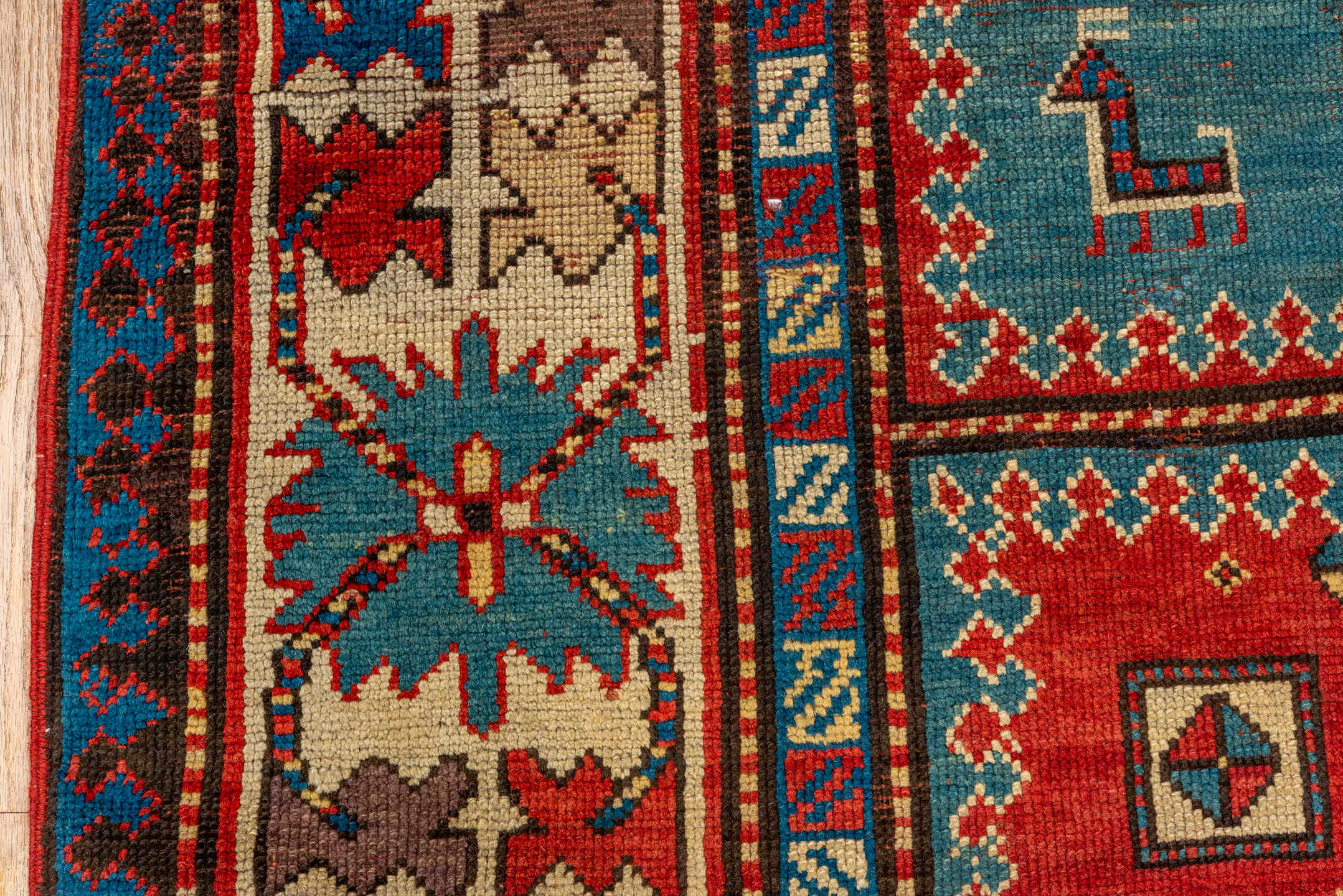 4' x 7' one-of-a-kind handmade antique Kazak rug. Color palette: ivory, red, sky blue, navy, rust, taupe, teal, light blue