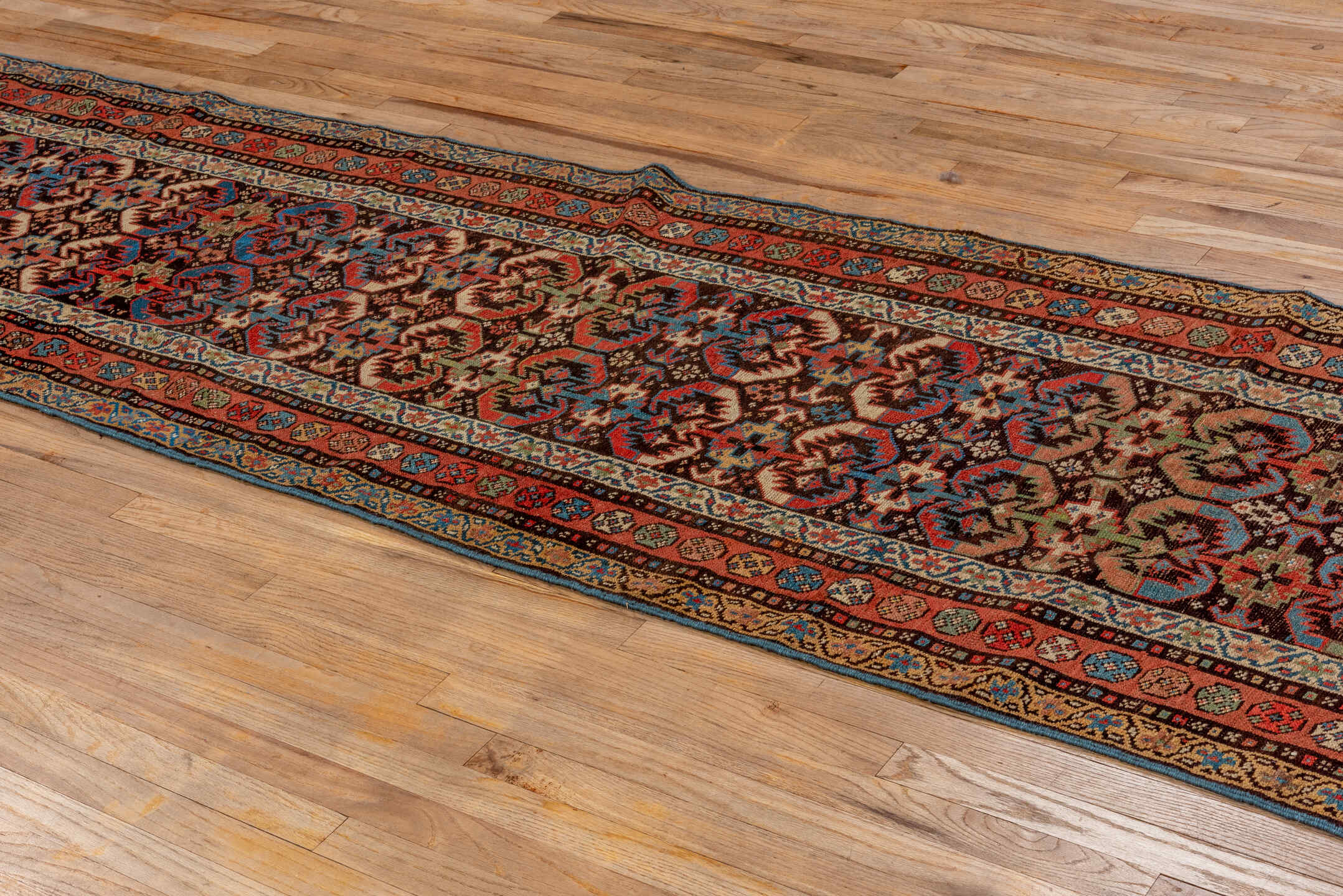 2' x 12' one-of-a-kind handmade antique NW Persian runner rug. Color palette: brown, rust, navy, ivory, camel, indigo