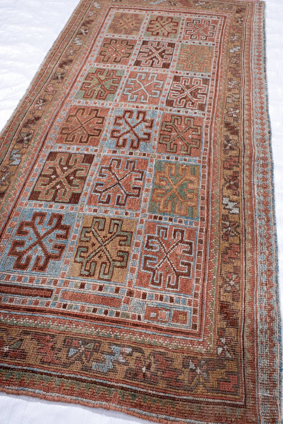 2' x 4' one-of-a-kind handmade antique Sumak small size rug. Color palette: rust, camel, sky blue, ivory, olive, brown