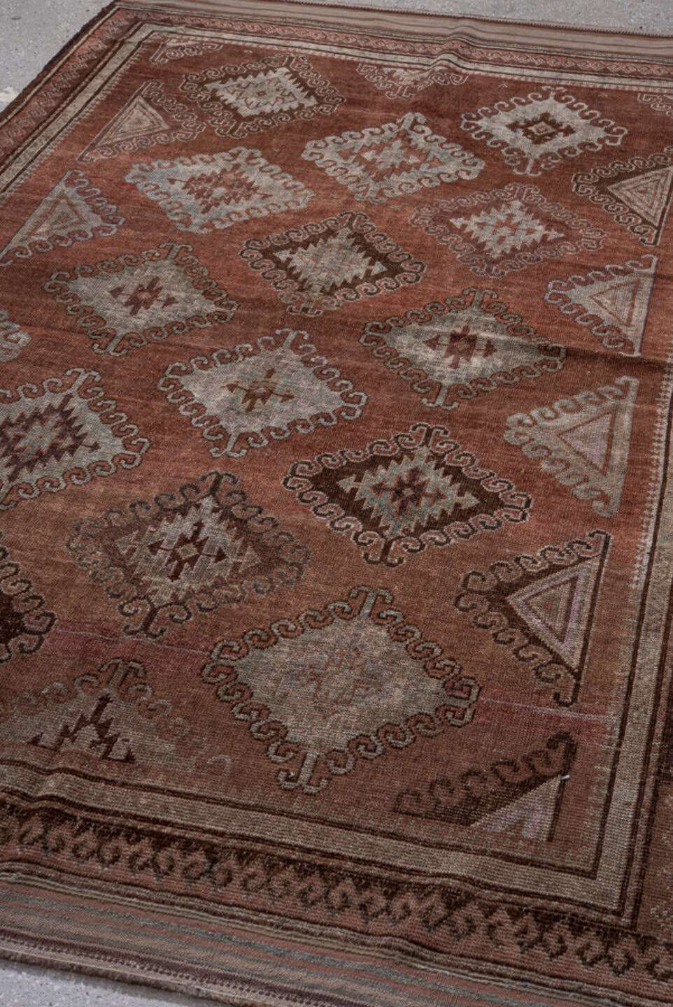 4' x 7' one-of-a-kind handmade antique Belouch rug. Color palette: rust, brown, taupe, ivory, charcoal, rose, slate