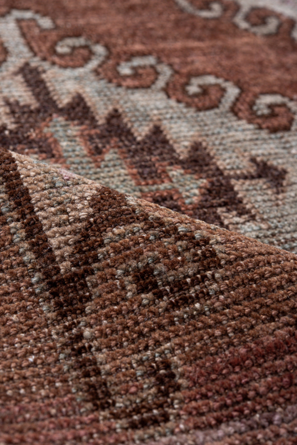 4' x 7' one-of-a-kind handmade vintage Belouch rug. Color palette: brown, gray, pink