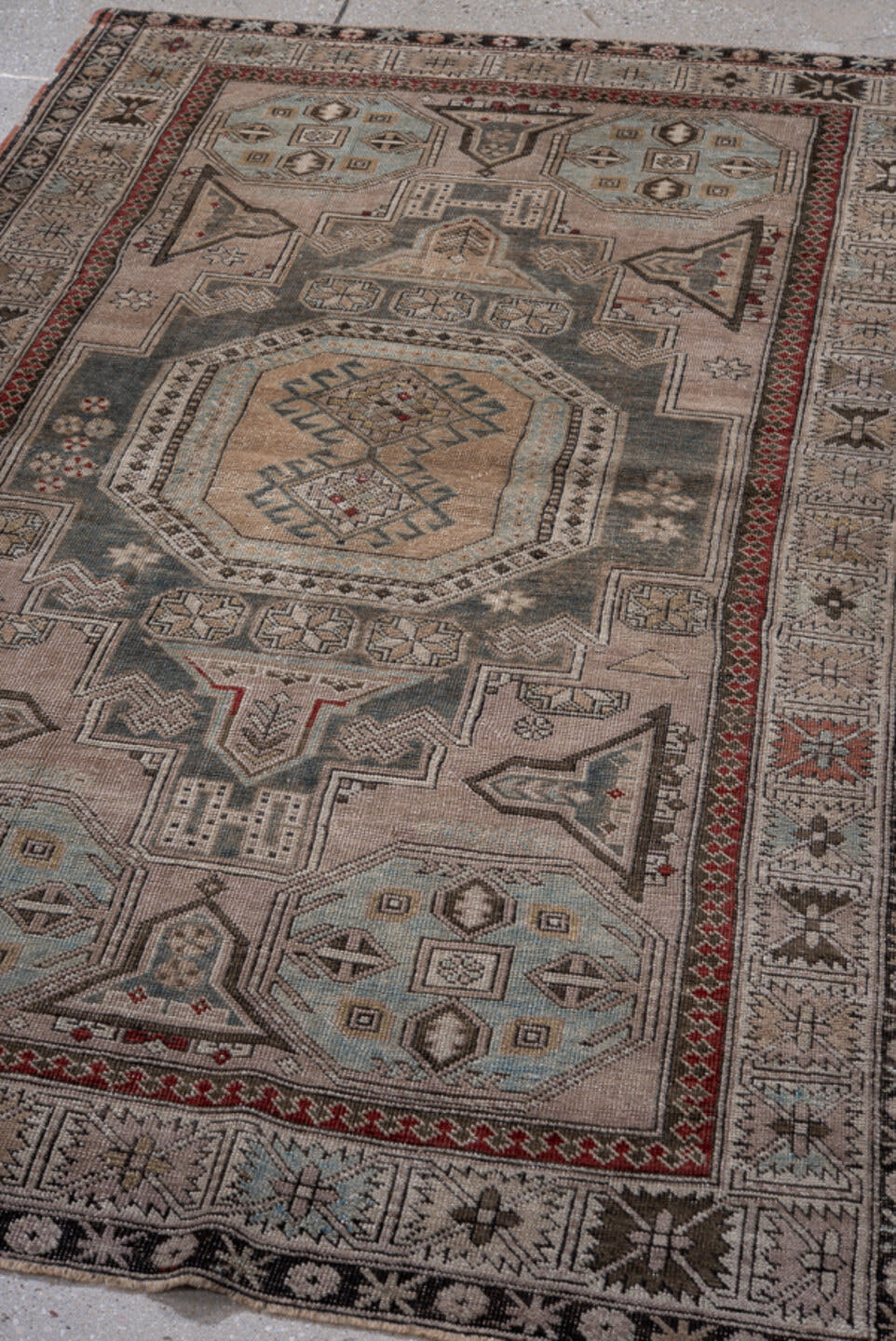 4' x 6' one-of-a-kind handmade antique Shiraz small size rug. Color palette: ivory, charcoal, sky blue, rust, taupe, black